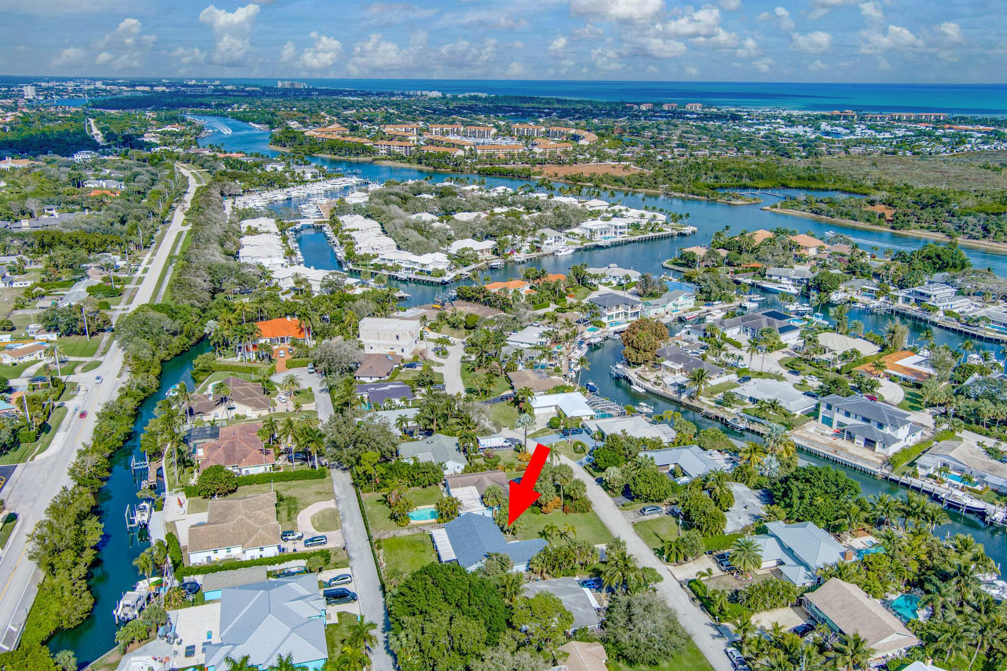Right on the Juno Beach line, across from multi inter-coastal. Beside Trump National Country Club. in the most desirable private neighborhood. 3 bedrooms, 2 bathrooms, 2 car garage, screened in patio, lights, fans, large gated back yard, formal dining room, large eat in kitchen, volume ceilings, large master and walk in closet. 1 mile to Juno Pier and beaches. Perfect place to experience the upscale Florida life style and this property is zoned for Airbnb and can generate revenues upward to 120k annually and is close to the Gardens Mall, Downtown at the Gardens, great restaurants, fitness centers and more!