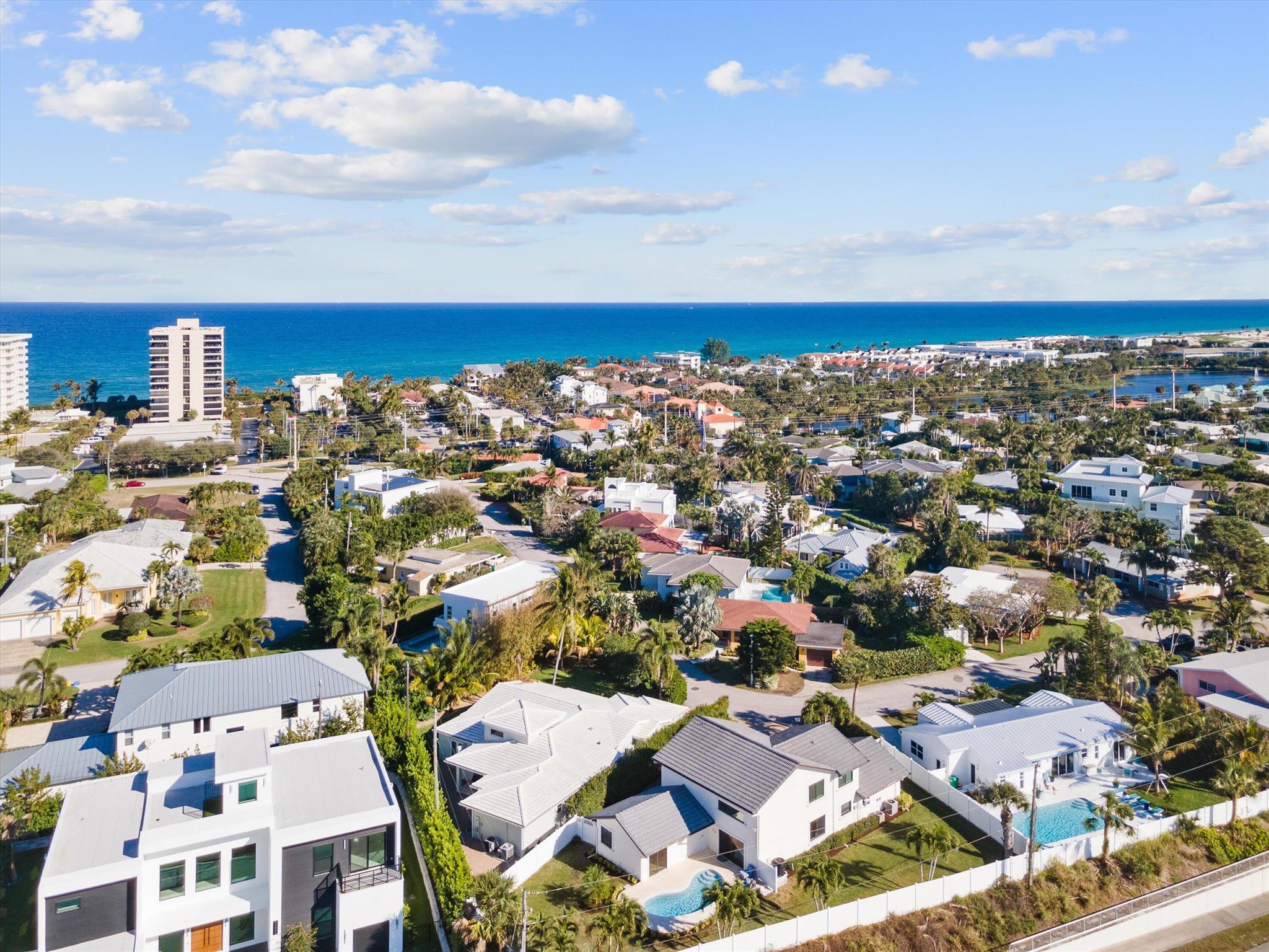 Step into luxury coastal living with this fully renovated 4-bedroom, 3.5-bathroom home, just steps from the beach in highly sought-after Juno Beach. Nestled on an elevated lot 35' above sea level, this property boasts a spacious backyard, lush landscaping, and a heated pool--perfect for outdoor entertaining. Inside, you'll find a brand-new designer kitchen, featuring an expansive quartz island, custom cabinetry, and all-new high-end appliances, making it the heart of the home. The highly desirable floor plan offers a first-floor primary suite with a spa-like en-suite bathroom, walk-in closet, and private backyard access. The three additional oversized bedrooms upstairs provide ample space for family and guests. SEE MORE REMARKS... This home also features completely renovated bathrooms with top-of-the-line finishes, brand-new flooring throughout, new impact windows and doors, and fresh paint inside and out. The open-concept great room flows seamlessly to the dining area and kitchen, with large windows and sliders allowing for abundant natural light and effortless indoor-outdoor living. Situated on a large, private lot, this move-in-ready home offers the perfect blend of modern elegance and beachside tranquility. Don't miss this rare opportunity to own in Juno Beach!