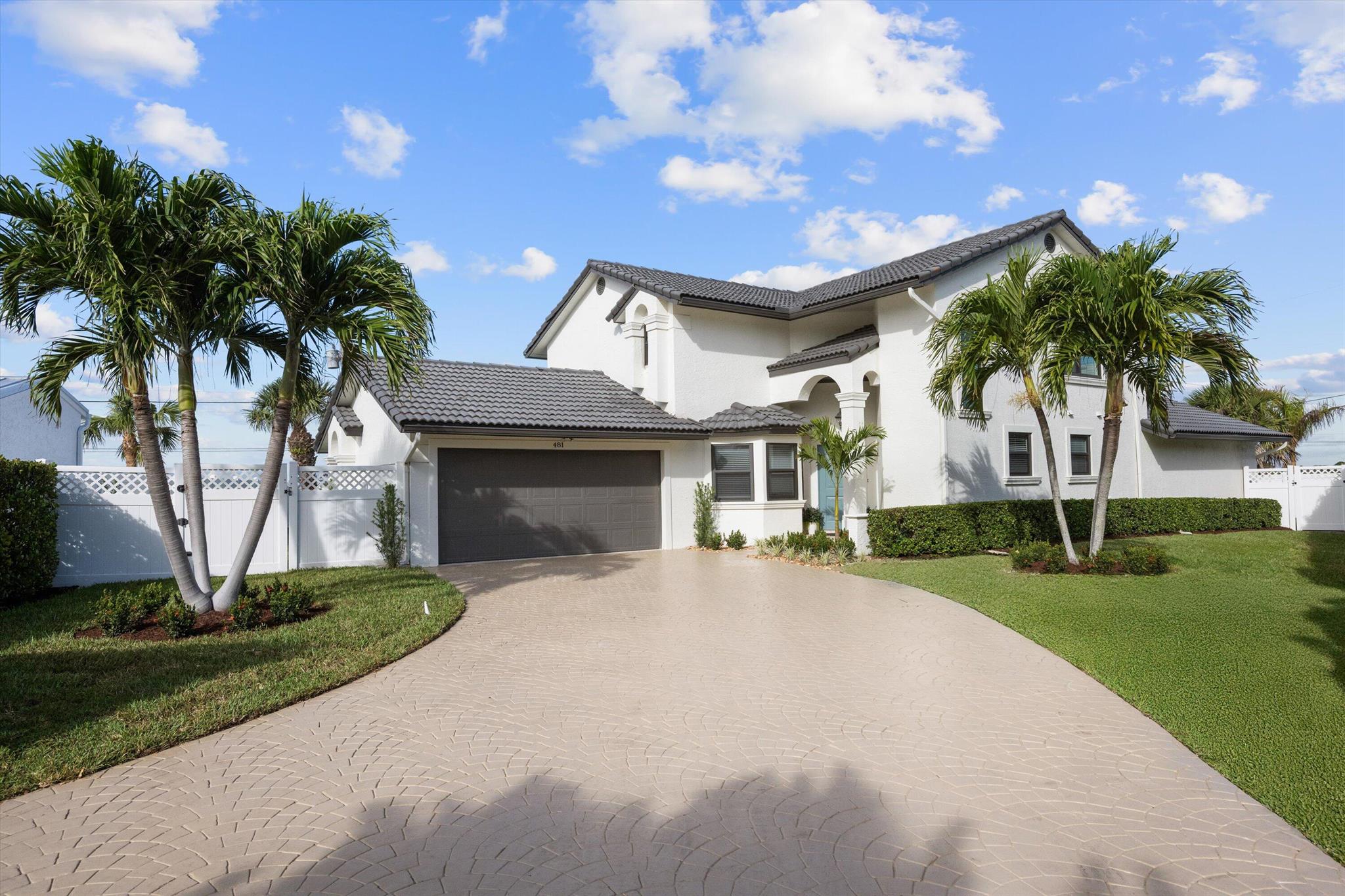 Step into luxury coastal living with this fully renovated 4-bedroom, 3.5-bathroom home, just steps from the beach in highly sought-after Juno Beach. Nestled on an elevated lot 35' above sea level, this property boasts a spacious backyard, lush landscaping, and a heated pool--perfect for outdoor entertaining. Inside, you'll find a brand-new designer kitchen, featuring an expansive quartz island, custom cabinetry, all-new high-end appliances and 2 brand new (2025 AC systems.  , making it the heart of the home. The highly desirable floor plan offers a first-floor primary suite with a spa-like en-suite bathroom, walk-in closet, and private backyard access. The three additional oversized bedrooms upstairs provide ample space for family and guests. SEE MORE REMARKS... This home also features completely renovated bathrooms with top-of-the-line finishes, brand-new flooring throughout, new impact windows and doors, and fresh paint inside and out. The open-concept great room flows seamlessly to the dining area and kitchen, with large windows and sliders allowing for abundant natural light and effortless indoor-outdoor living. Situated on a large, private lot, this move-in-ready home offers the perfect blend of modern elegance and beachside tranquility. Don't miss this rare opportunity to own in Juno Beach!