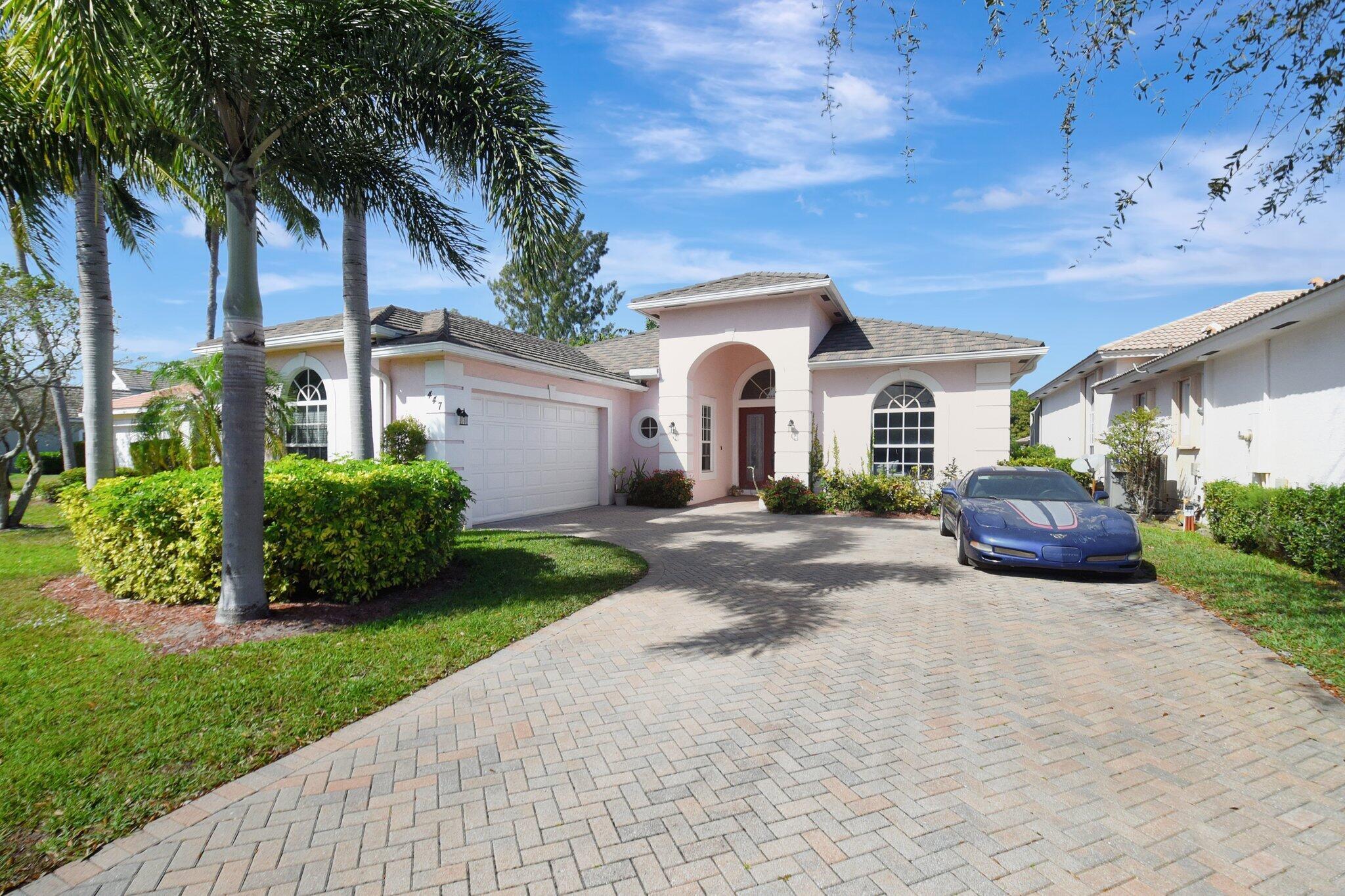 447 Pine Tree Court, Atlantis, Florida 33462