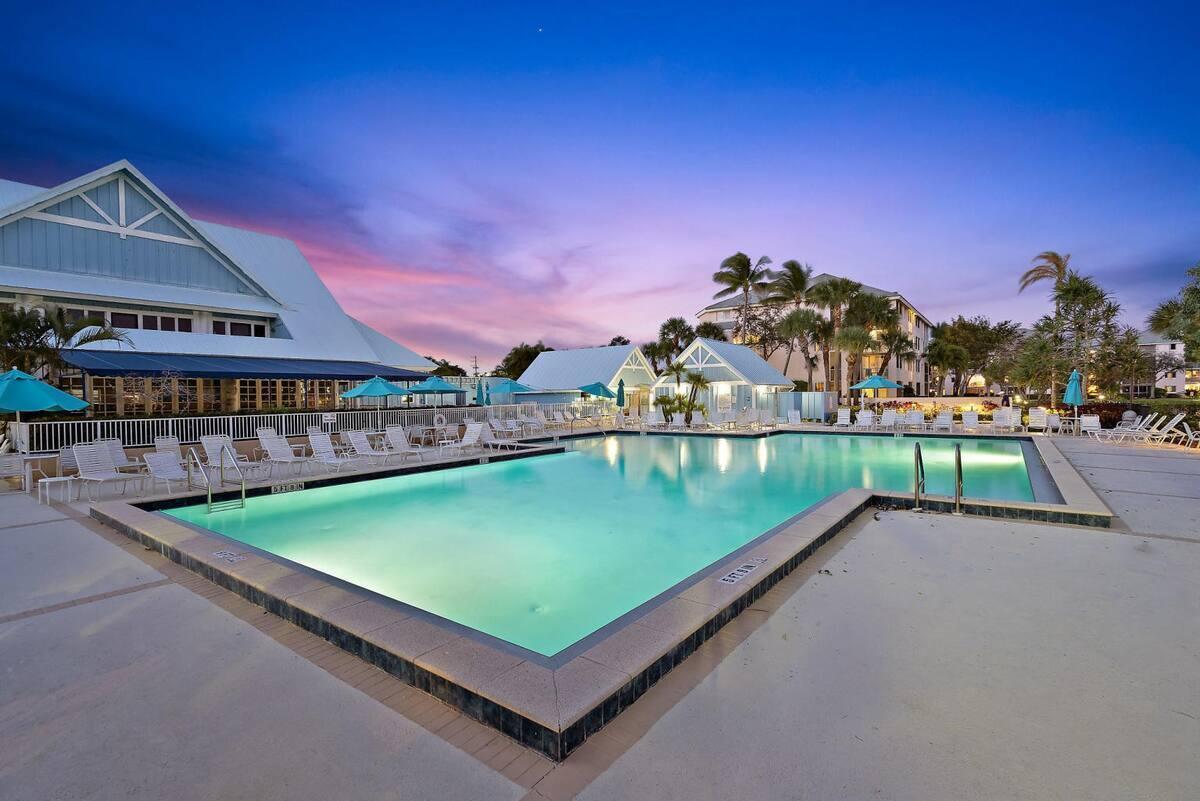 Rarely available first floor, no stairs, 2 bedroom/2 bath plantation villa in Jupiter Bay community is offered fully furnished, turnkey. Successful airbnb with daily rentals allowed. Rental income information will be shared upon request. Brand new roof 2025. Located within walking distance to shopping, restaurants, Carlin park, Riverwalk, Harbourside, theaters, beach. Enjoy a beverage on your private screened in patio or take a swim in one of the community pools, play tennis or golf nearby. Incredibly easy to rent immediately. Great opportunity to own this piece of paradise!