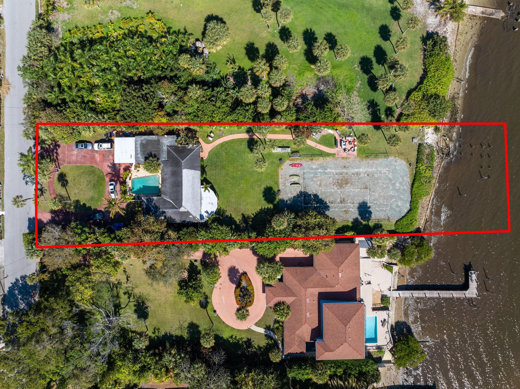 Rare Waterfront Opportunity: 100' of Direct Intracoastal Frontage in Highly Desired Lake Worth Beach. This 4-bed, 3.5-bath home sits on nearly an acre w/ 100' of direct Intracoastal frontage, offering stunning water views from every angle & the ability to build your own private dock. Move in as is or tear down & build a luxury waterfront estate like others in the area. The adjacent lot at 530 S Lakeside Dr. is also available, adding 120' of frontage--buy separately or together for 220' total & almost 2 acres. Enjoy easterly breezes, breathtaking sunrises & gorgeous western sunsets. Features include a private pool, fenced yard, enclosed sunroom w/ wood-beam ceilings, wood-burning fireplace, bonus room, attached garage & circular driveway. 5 mins drive to the beach and Four Seasons Resort.