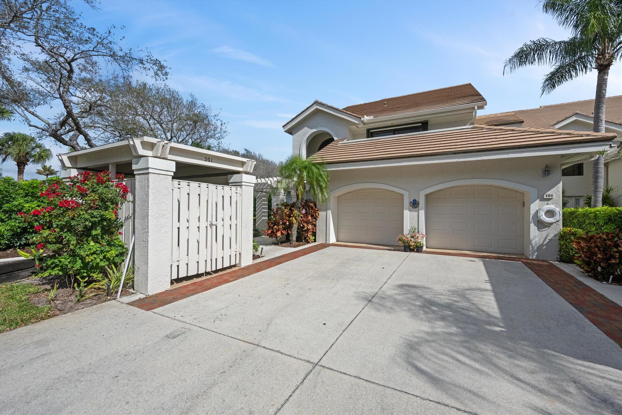 Meticulously maintained corner unit boasting PANORAMIC lake views. This 2 bedroom, 2 bath PLUS den, West Bay townhome in the highly sought after community of Jonathan's Landing is move-in ready and priced to sell! As you enter the unit you are greeted with high vaulted ceilings and tons of natural light. The owner's suite offers 2 spacious walk-in closets and a private balcony with unobstructed lake views. There is plenty of room to entertain with 2 living spaces and option to convert the den into a third bedroom. Additional features include in-unit laundry, attached garage, golf cart storage and access to West Bay's pool and clubhouse. Jonathan's Landing offers a variety of memberships if you choose to join the private club. Conveniently located near shopping, dining, and major highways, this townhome will provide you with both tranquility and accessibility. Being offered fully furnished including your own private golf cart to roam all that Jonathan's Landing has to offer, you wont want to miss the opportunity to make this lakeside gem your own!