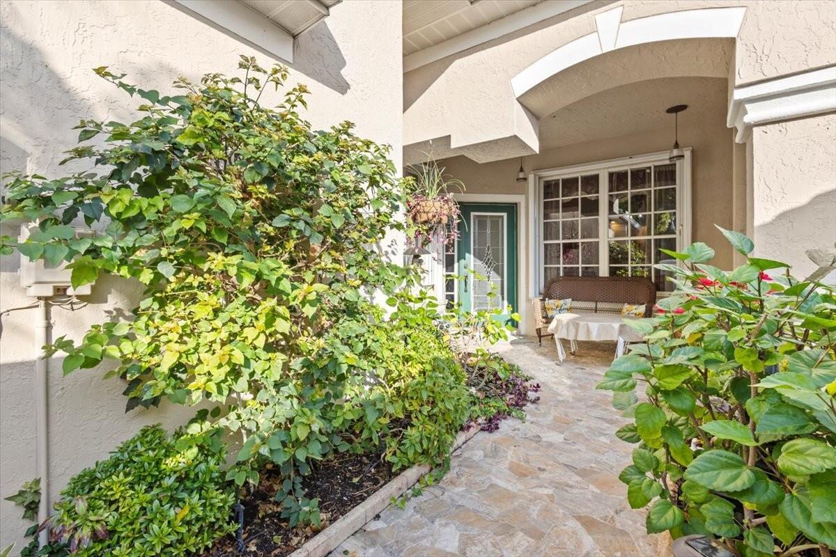 Lakefront living in the heart of St. Lucie West! Enjoy one of the few homes with a private dock on the lake--perfect for non-motorized boating or simply soaking in the views. This spacious 3BR, 2.5-bath townhome (2-car garage) features a desirable first-floor primary suite with, dual vanities, walk-in shower and a custom walk-in closet. The open layout includes a bright kitchen,  soaring ceilings, formal dining area, and generous living space.  Full accordion shutters provide peace of mind.  Located in the gated community of Lake Charles, residents enjoy resort-style amenities including a clubhouse, pool, spa, tennis, pickleball, playground, and miles of walking paths. HOA includes basic cable and exterior roof maintenance. Minutes from top-rated schools, shopping, dining, and I-95.