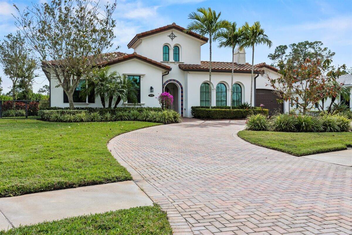 Discover the beauty and tranquility of this exceptional lakefront home, located in the exclusive, gated community of Riverbend in Palm City, FL.   As you enter, you're greeted by an inviting, light-filled open space with elegant wood plank flooring throughout the main living areas. With 4 spacious bedrooms, 5 and a half bathrooms; spread across 3,625 square feet, this home offers the perfect balance of luxury and comfort.Designed with both style and practicality in mind, the home features a living room, family room, and a formal dining space; ideal for entertaining. The chef's kitchen is a standout, offering sleek quartz countertops, top-of-the-line appliances, including a Sub-Zero refrigerator, Jenn-Air gas range, and double wall ovens, breakfast bar, breakfast nook plus a walk-in pantry with custom shelving. The kitchen seamlessly flows into the family room, where sliding doors open to a covered lanai that overlooks your private pool and serene lake views.
The expansive primary suite provides a peaceful retreat with captivating lake and pool views.  Enjoy a cozy sitting area, tray ceilings, crown molding, and two walk-in closets with custom built-ins.  The primary bath offers a spa-inspired experience, featuring a soaking tub, walk-in shower, dual vanities, and two toilets. Three more bedrooms each have their own ensuite bathrooms, ample closet space round out this beautiful home.
This residence boasts a range of high-end features, including Hunter Douglas blinds, crown molding, built-in entertainment center, surround sound, central vacuum system, hurricane impact windows and doors, a Nest thermostat, a 250-gallon propane tank, and a full-house automatic generator for peace of mind. Outside, unwind in your private covered lanai with a stunning tongue-and-groove ceiling, and electric screens.  Take a refreshing dip in the heated, free-form saltwater pool. Recent updates, such as a 2023 main AC unit, a new water filtration system (2024), and updated pool equipment.
As a resident of Riverbend, you'll enjoy exclusive access to a day dock, a pavilion with seating, and a grill.
This home offers the perfect setting for luxurious, relaxed living&#x14;come see for yourself!