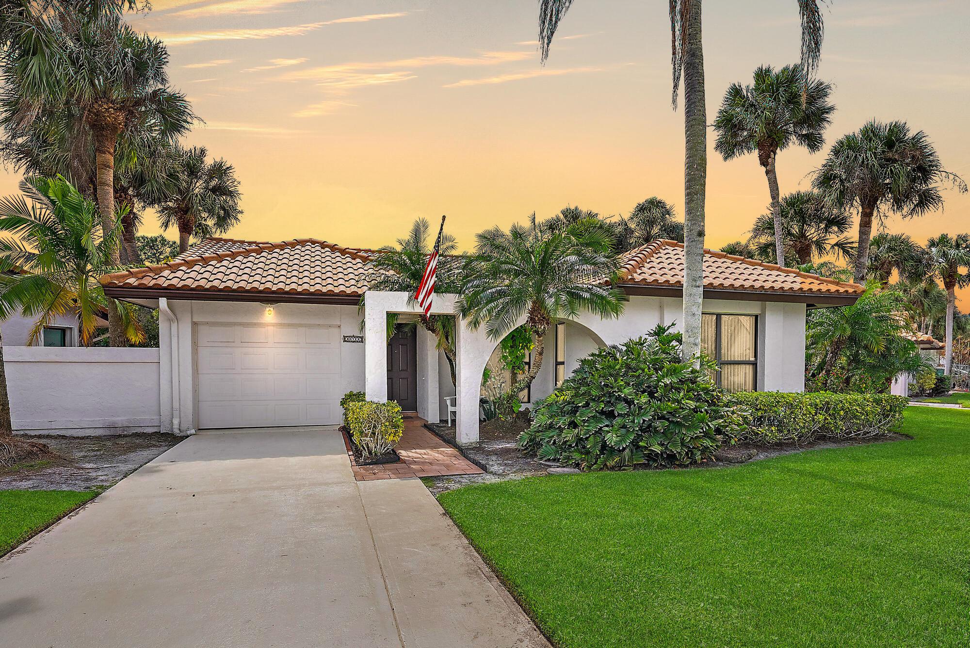 Welcome to this beautifully maintained three-bedroom, two-bathroom home in the sought-after Martin Downs Golf Community, located on a spacious corner lot. With premium finishes throughout, this home is a true gem. The updated kitchen features custom wood cabinetry, granite countertops, and top-of-the-line appliances, including a new LG gourmet built-in oven and microwave, LG cooktop, and Bosch dishwasher. Additional highlights include full impact windows, LVP flooring, 2023 and 2019 Maytag washer and dryer, a 2024 Ruud UV light handler, and a 2021 hot water heater. Step outside to an extended driveway with plenty of room for extra vehicles and a new epoxy garage floor. The seller has secured permits and approval for a polyroof screen enclosure for backyard patio. Triple A rated schools. This vibrant community offers an abundance of amenities for everyone to enjoy! Dive into two pools, including an Olympic-size pool and a 6-foot pool with a hot tub, all set against a sandy beach area. There's also an expansive turfed playground for kids, turfed pickleball courts, bocce ball courts, beach volleyball, tennis courts, and basketball courts. Multiple tiki huts and open-air pavilions provide excellent spots for entertaining, while social clubs, movie nights on the lawn, and monthly food trucks bring the community together. Fur friends are welcome at the joining dog park, and picturesque fitness trails invite you to explore the beauty of your surroundings.