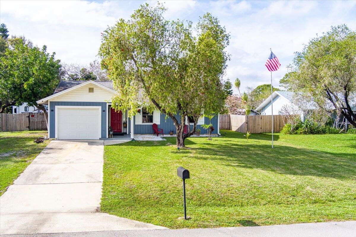 You will love this beautifully maintained Former Model Home - No HOA & Brand-New Roof Coming! This charming and spacious 2-bedroom, 2-bathroom former model home, is perfectly situated on an oversized lot outside the Parkwood HOA! Enjoy the freedom of no restrictions or fees! Step inside to a welcoming great room featuring vaulted ceilings and an open-concept layout, Stylish laminate flooring throughout, Tropical ceiling fans adding Florida lifestyle vibe. Newer AC system ensuring year-round comfort. Split-bedroom floor plan for privacy and functionality. The expansive backyard is designed for relaxation and entertainment, boasting a large fenced yard, above-ground pool, screened porch, and open patio area, perfect for outdoor gatherings. Plus, enjoy a newer 30-amp RV receptacle for added convenience! Additional updates include a brand-new roof coming soon and seller addressing minor wood rot near the screened patio for peace of mind. Ideally located near top-rated schools, shopping, dining, beaches and essential services. All measurements are approximate. Buyer to verify. Don't wait, schedule your private showing today!