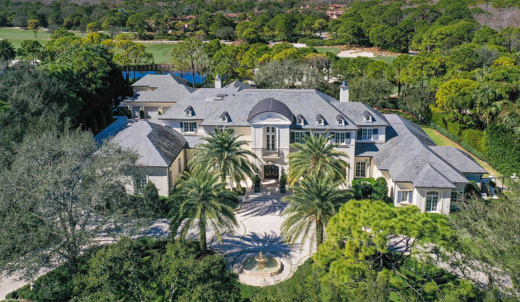 Elegant French Country estate home located on over 1.6 acres on one of the most sought over locations within The Bears Club. This property features expansive lake and golf course views of the 13th and 14th hole of the Nicklaus Signature course at The Bears Club to the rear with views from the front facing living spaces of a largest manicured residential lake within the community. This was the first lot selected within The Bears Club community when all of the custom homesites were available. The home was completely renovated in 2015 by Lavelle Construction and features the highest levels of fit and finish throughout.