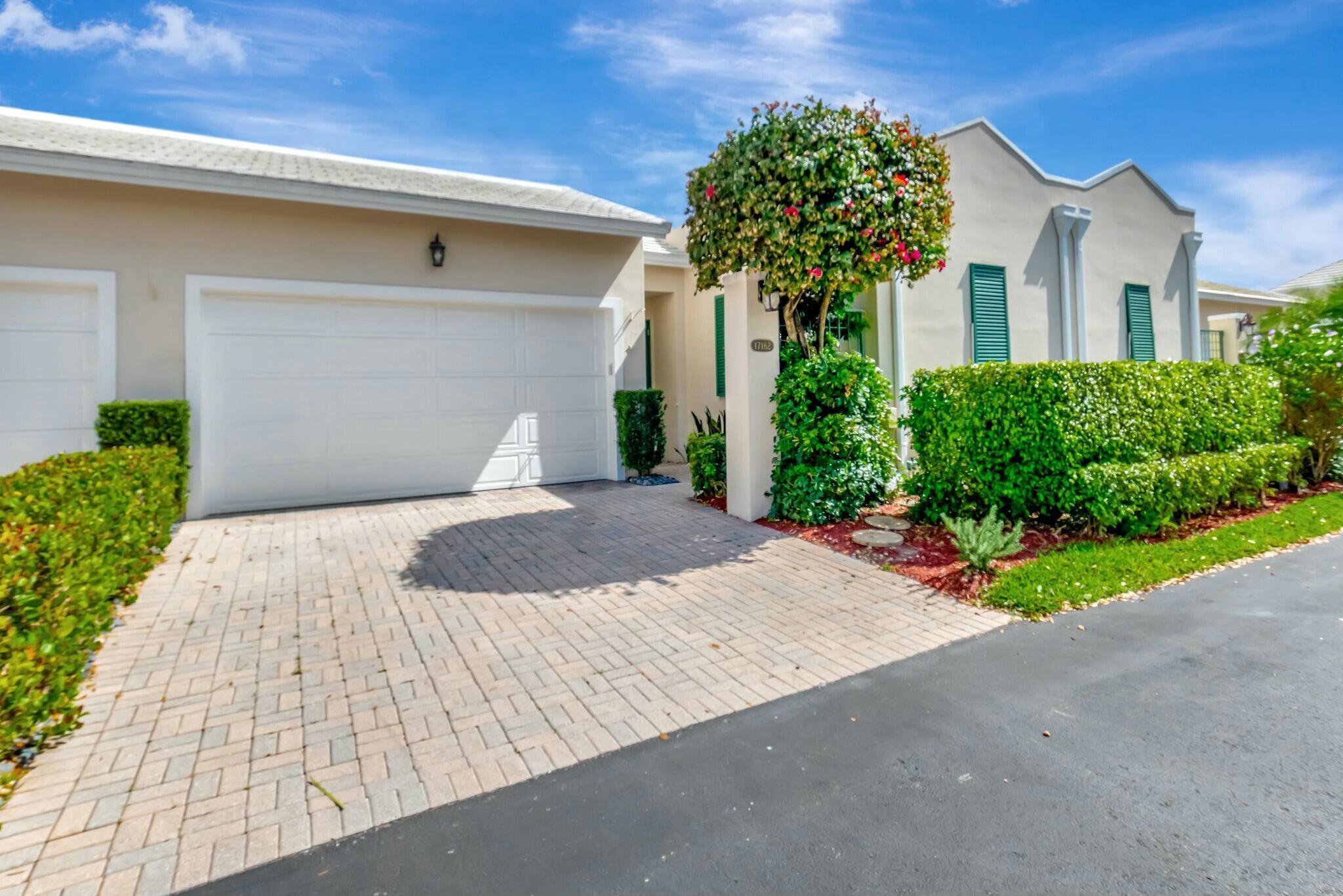 Fabulous 3 bed 3 bath court yard home in Boca Country Club. Soaring ceilings throughout main house that has 2 bed/2 baths that overlook a golf course. White kitchen with quartz bar opens to dining and living room. Large primary bedroom and huge walk in closet with built ins and features an additional dressing room space.  Detached guest house has full bath and walk in closet with built ins. Courtyard can be shaded by large retractable awning. Heated Spa with new pump and heater. Roof was replaced in 2019.  2 car garage has coated flooring, washer/dryer and extra fridge.  AC and air ducts recently cleaned.  HOA fee includes Cable & WiFI.