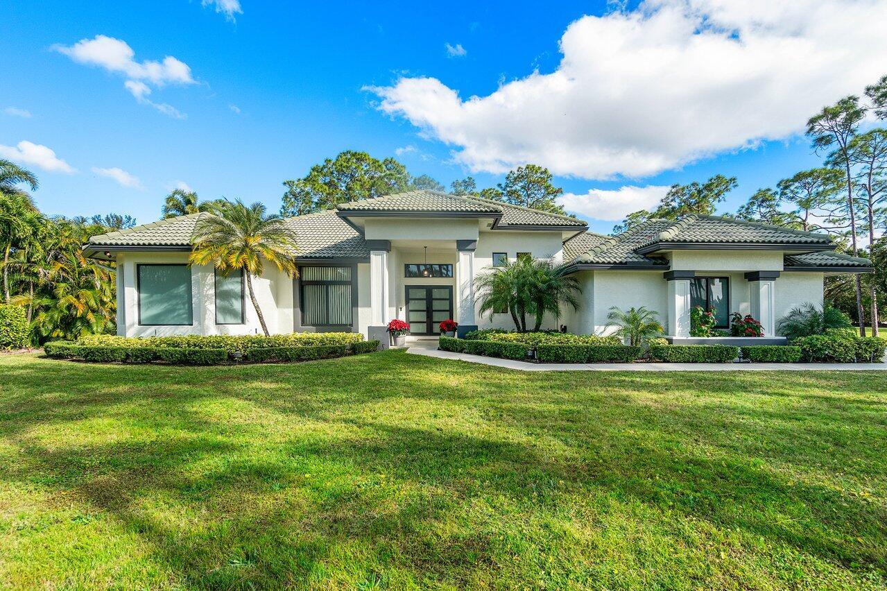 Stunning & Tranquil 5-Bedroom, 3-Bathroom Pool Home in Bay Hill EstatesNestled on a spacious 1.1-acre lot in the prestigious Bay Hill Estates community, this beautifully maintained home offers an exceptional blend of privacy, functionality, and serenity. Designed with a thoughtful split floor plan, it provides both comfort and convenience for modern living.                           Key Features:Upgraded Garage - New flooring, cabinetry, and doorHurricane-Impact Doors & Windows - Ensuring safety and energy efficiencyFresh Interior & Exterior Paint - A refreshed and modern lookSecurity Ready - Pre-wired for surveillance cameras. Brand new AC unit 2025Electric Vehicle Charger - Convenient and eco-friendlyCustom Closets - Professionally designed storage in all bedroo
