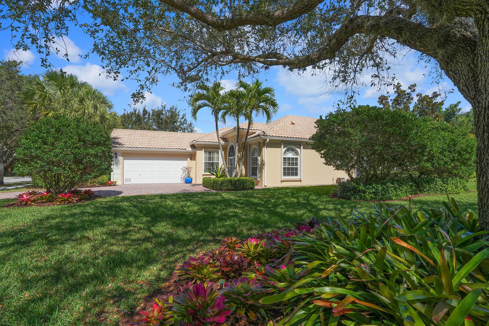 Stunningly renovated single story home in gated Magnolia Bay on premier 1/3 acre private lot.  Huge screened  patio with heated salt water pool on the lake.  This beautifully renovated home boasts tile floors, stainless steel appliances, updated kitchen cabinets, gorgeous soft grey granite in the kitchen.  Freshly painted  interior.  Crown molding with 12 ft  ceilings in great room  & 10 ft ceilings in bedrooms. The master suite will impress with impact sliders to the pool deck and a bank of closets with walk in.  The unusual split Master bath has stunning marble tile thru out with quartz counters and a new roll in no step shower fully glassed for ease of access. The guest bath  also boasts marble and quartz thru out.  Pull your cars into the garage with new epoxy floor & built ins