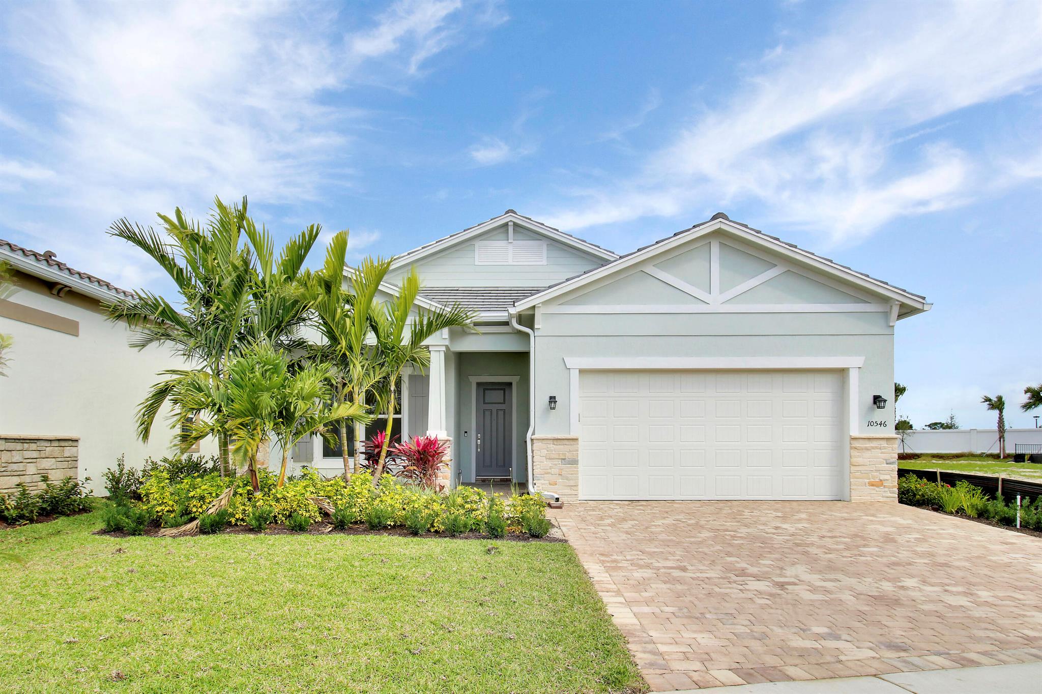 This beautiful NEWLY CONSTRUCTED, never-lived-in home is now available for sale! You won't have to wait for it to be built--this modern gem is move-in ready with all the bells and whistles. 3 bedroom + flex room (office/bedroom), 2 bathrooms, 2 car extended garage. Featuring more than $90,000 in builder upgrades -warranties transferable to buyer-Property qualifies for a CLOSING COST CREDIT through the Seller's preferred lender (details avail)  High-end aftermarket touches, including an extended 4ft garage to fit larger trucks, designer walls, and a custom built-in entry bench, this home is perfect for those seeking style and functionality.Equipped with top-tier features like a gas range stove, impact windows and doors, and a thoughtfully designed layout, this property is bright, airy brings the Florida sun indoors.

A Home with Everything You Need:
Extended garage to accommodate larger vehicles.
Designer walls and custom touches throughout.
Impact windows and doors for safety and energy efficiency.
Gas range stove for cooking enthusiasts.
Thoughtful layout maximizing space and comfort.
This home has it all&#x14;modern, bold, and designed to be intimately personal. Plus, it's priced competitively compared to new builder models, offering incredible value for its upgraded features.

Resort-Style Living at Your Doorstep
The community offers resort-style amenities, including:
Clubhouse with a resort-style pool and spa.
Fitness center for your daily workout.
Kids playroom to keep the little ones entertained.
Pickleball and Tennis courts for some active fun.
Covered dining areas for family gatherings.
And that's not all! A town center is coming soon, featuring a Publix, Home Depot, restaurants, and shops&#x14;everything you need, just minutes away.
Surrounded by the best of Palm Beach County, this home is ready for its first owners. Don't miss out on this incredible opportunity! Call today to schedule a tour!