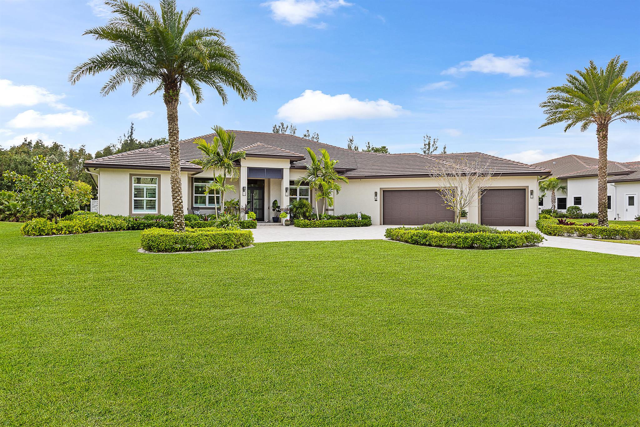 Tucked away on a quiet, one-acre preserve lot, this 2022-custom built home offers over 5,000 square feet of thoughtfully designed living space. It's a full Smart Home, with everything from internet boosters in every room to Sonos audio, built-in security, OVRConnect, and a standby generator for peace of mind.Inside, the home is filled with custom touches--coffered ceilings, beautiful built-ins, and electric fireplaces in both the family room and the primary suite. The oversized three-car garage is climate-controlled and fully insulated with finished epoxy flooring and plenty of room for storage.The kitchen features double islands, quartz counters, top-of-the-line appliances, and custom cabinetry throughout. For added air quality &amp; efficiency, the HVAC system is equipped with UV lights. The backyard oasis is a true retreat, backing up to a serene preserve for ultimate privacy. It features a PebbleTec heated saltwater pool with spa, a travertine pool deck, &amp; a large, covered patio with a fully equipped summer kitchen&#x14;including a high-end built-in grill, refrigerator, sink, &amp; granite countertops. Enjoy additional outdoor luxuries like a private shower &amp; a spacious yard perfect for pets &amp; play. The primary suite boasts his &amp; her walk-in closets with custom built-ins, a spa-like bath with dual vanities, a freestanding soaking tub, &amp; a step-in shower with dual showerheads. The chef's kitchen offers high-end appliances, custom cabinetry offering ample storage, &amp; a dual island layout. Nestled in a prestigious community with an PGA Golf Club membership (optional), this home is a rare find.