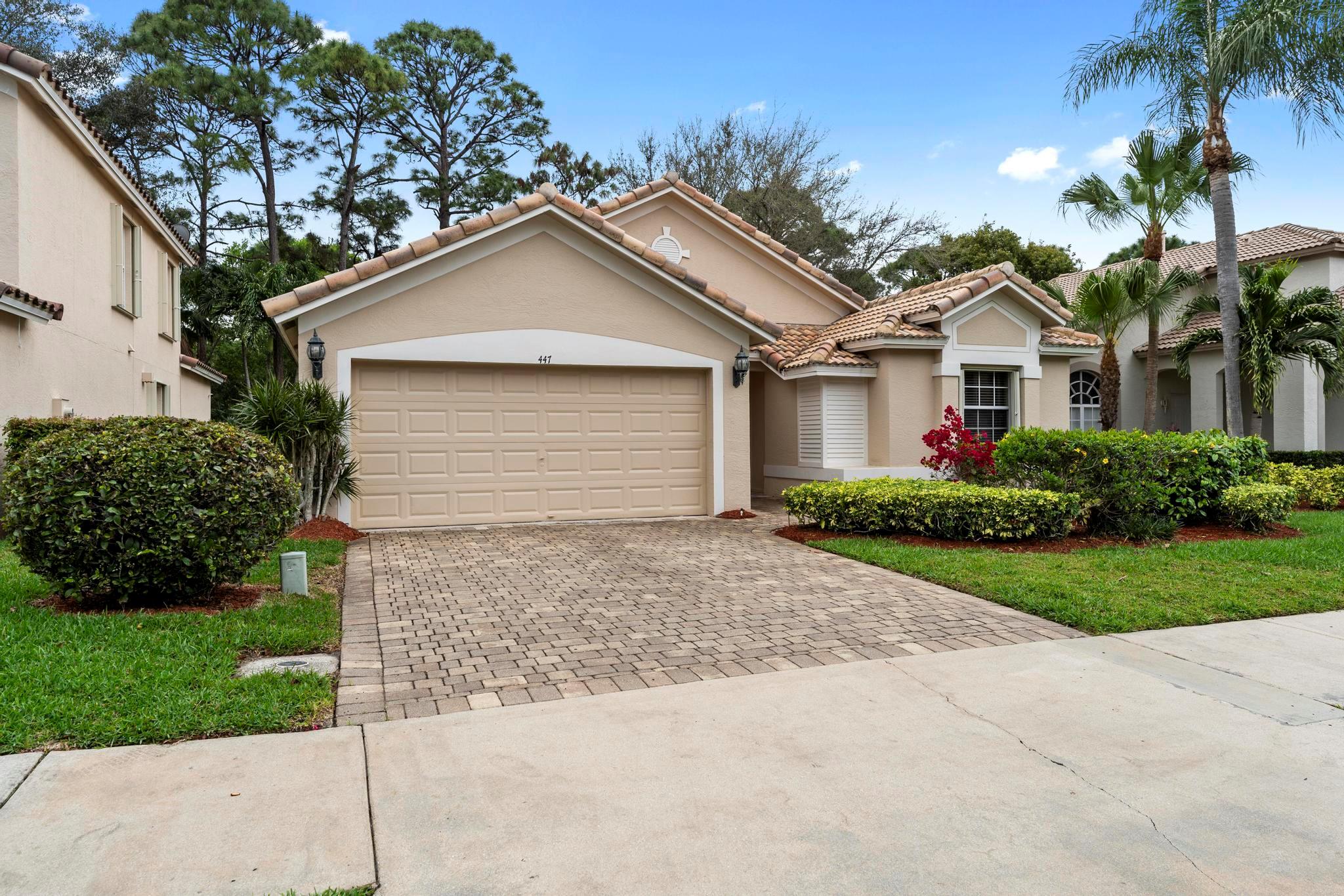 Step into this well-maintained 3 bedroom, 2 bathroom home with a 2 car garage, where vaulted ceilings and abundant natural light create an airy, open feel throughout. The beautiful LVP flooring in the main living areas complements the spacious layout, enhancing the home's welcoming atmosphere. The split floor plan offers privacy and convenience, with the open kitchen featuring white cabinets, granite countertops, and a pantry, making it perfect for both cooking and entertaining. The cozy primary bedroom offers a walk-in closet and a private en-suite bathroom with double sinks and a step-in shower. The large screened-in patio is ideal for relaxing or hosting gatherings while enjoying the outdoors in comfort. With a new roof (2023), a newer A/C (2021), and complete accordion shutters, this home offers peace of mind for years to come. The community offers a pool and pickleball courts, providing great recreational options. Ideally located between the Turnpike and I-95, it's also just minutes from The Gardens North County District Park, Joseph R. Russo Athletic Complex, as well as a variety of restaurants and shops. It's an ideal combination of style, space, and functionality. Don't miss the chance to make it yours!