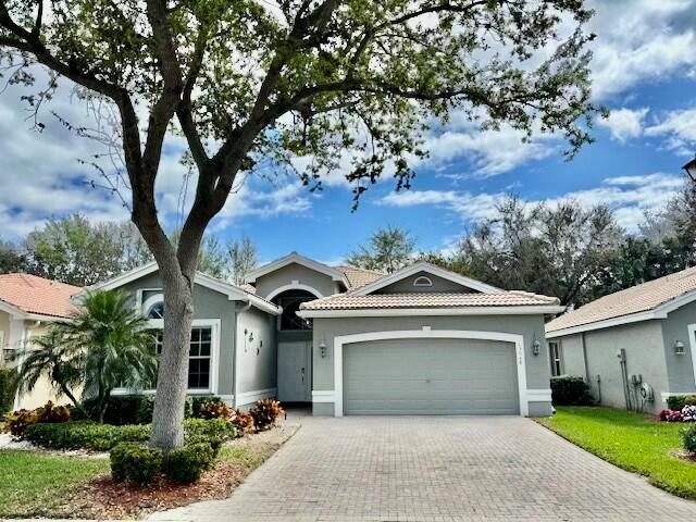 UNIQUE 4 BEDROOM MEDITERRANEAN MODEL WHICH HAS MANY UPDATES THROUGHOUT THE HOUSE!  DON'T USE THE FORMAL THE LIVING ROOM BUT NEED ANOTHER GUEST BEDROOM OR OFFICE?  THIS IS THE HOUSE FOR YOU!  THE LIVING ROOM HAS BEEN ENCLOSED TO CREATE AN OFFICE/DEN/4TH BEDROOM.  IT HAS NEUTRAL TILE THROUGHOUT THE HOUSE EXCEPT FOR FRONT BEDROOM.  THE KITCHEN HAS BEEN UPDATED WITH QUARTZITE COUNTERTOPS, STAINLESS STEEL APPLIANCES, DOUBLE OVEN & UPDATED LIGHT FIXTURES.  THE PRIMARY BEDROOM HAS TRAY CEILING, DUAL FITTED CLOSETS & AN ENSUITE WITH QUARTZITE COUNTERTOPS, FRAMELESS SHOWER, SOAKING TUB & SEPARATE WATER CLOSET.  THE GUEST BATHROOM HAS NEWER QUARTZITE  COUNTERTOPS & LIGHT FIXTURES.  THE HOME ALSO HAS ACCORDION SHUTTERS.  ALL MEASUREMENTS &  INFO. DEEMED ACCURATE & SHOULD BE INDEPENDENTLY VERIFIED.