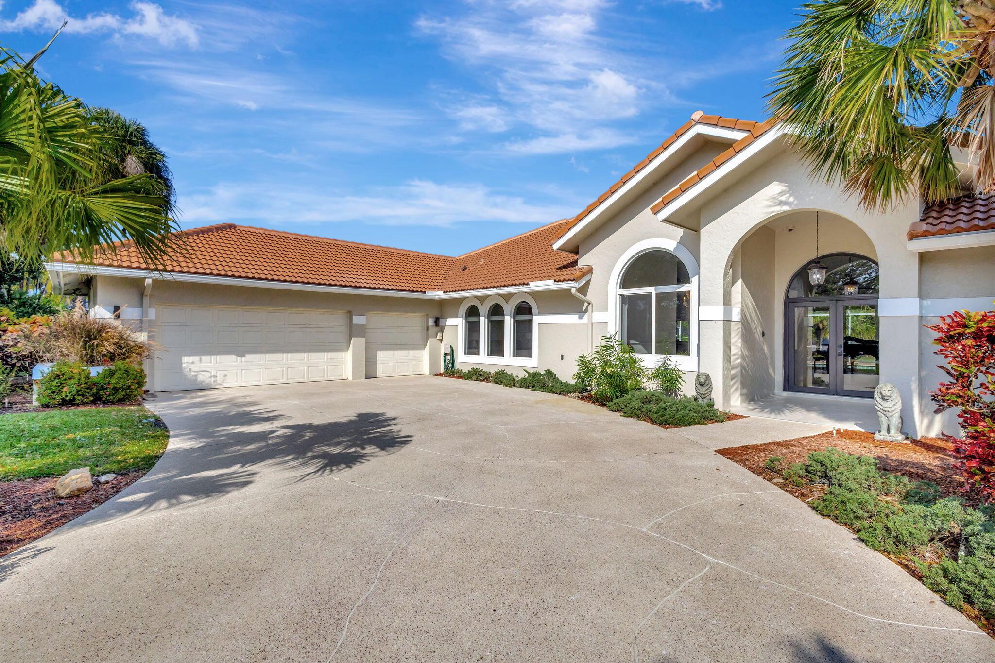 Imagine yourself in this sophisticated residence within the coveted Banyan Lakes gated community! Set on a lush, sprawling acre, this freshly painted abode presents a stunning interior with vaulted ceilings, stylish tile flooring, and upgraded impact windows. The entertainer's kitchen features stainless steel appliances, abundant cabinetry, and granite countertops extending to the multi-seater island. Your primary suite steals the show with its coved ceiling, walk-in closet, and convenient ensuite. A resort-inspired screened-in patio is ideal for gatherings by the pristine pool. Notables include brand-new roofing, an attached oversized 3-car garage, access to community amenities, and activities such as kayaking, water-skiing, and swimming. Come for a tour before it passes you by!
