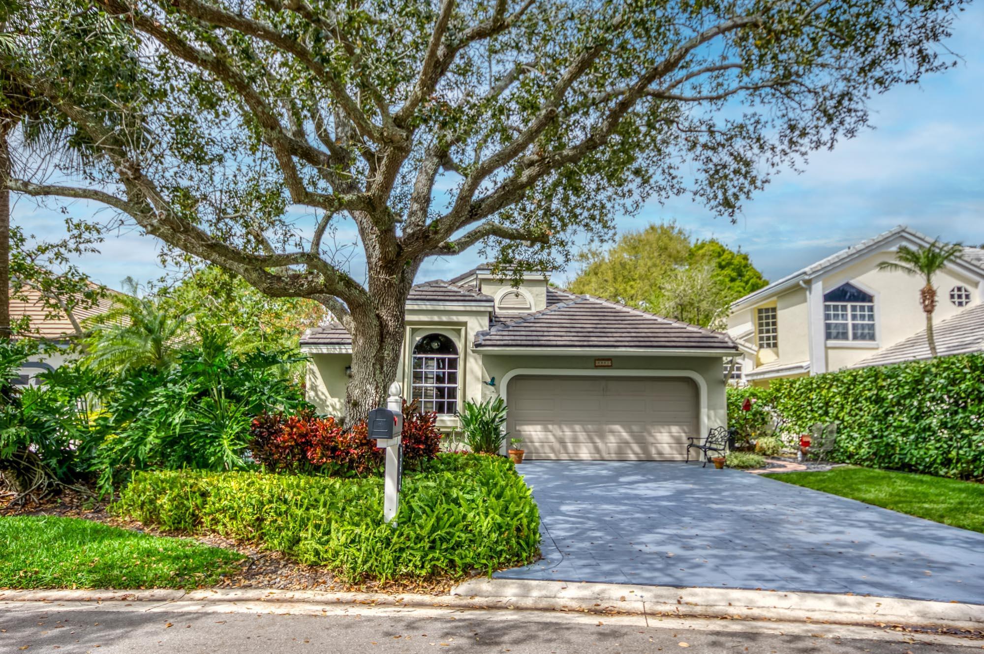Calling all dog lovers! This updated home has a rare fenced yard in Eastpointe!  Lovely open floor plan w/LR and DR adjoining with views through the sliders to the lanai and beyond to the butterfly garden and golf course. The kitchen has white cabinets with granite counters and stainless appliances.  Primary has 10 foot ceiling w/sliders to patio and a very spacious bath w/oversized double vanity, shower and separate tub.  3rd guest room serves as an open den that could be closed off. 2021 Roof and exceptional schools and community pool across the street. Eastpointe is ideally located close to lots of shopping and restaurants, 15 min to the airport, 10 to the beach. 2 Fazio golf courses, amazing newer recreation center called The Pointe with 2 pools, hot tub, firepits, restaurant and