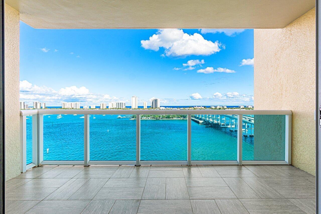 12th floor 2BR + den/2BA overlooking the Intracoastal & ocean. Brand new refrigerator (craft ice) & dishwasher,  full size washer/dryer 3 yrs old, range Feb 2023, extended 5 yr warranties. Impact glass, semi-private elevator access. Open concept, neutral colors, split floor plan w/ wood & tile flooring. Spacious owners suite w/his & her walk-in closets. Primary bath w/double vanity, jetted bath, water closet. Assigned garage parking (close to elevator!) & climate-controlled storage unit. 24/7 manned gate, valet, NEWLY renovated rooftop oasis w/pool, spa, BBQ areas, tennis, pickelball, & bocce. Clubhouse, billiard room & fitness center, walking path w/gazebo,  Adjacent marina w/dry docks, minutes to the ocean, no fixed bridges. Pet friendly.