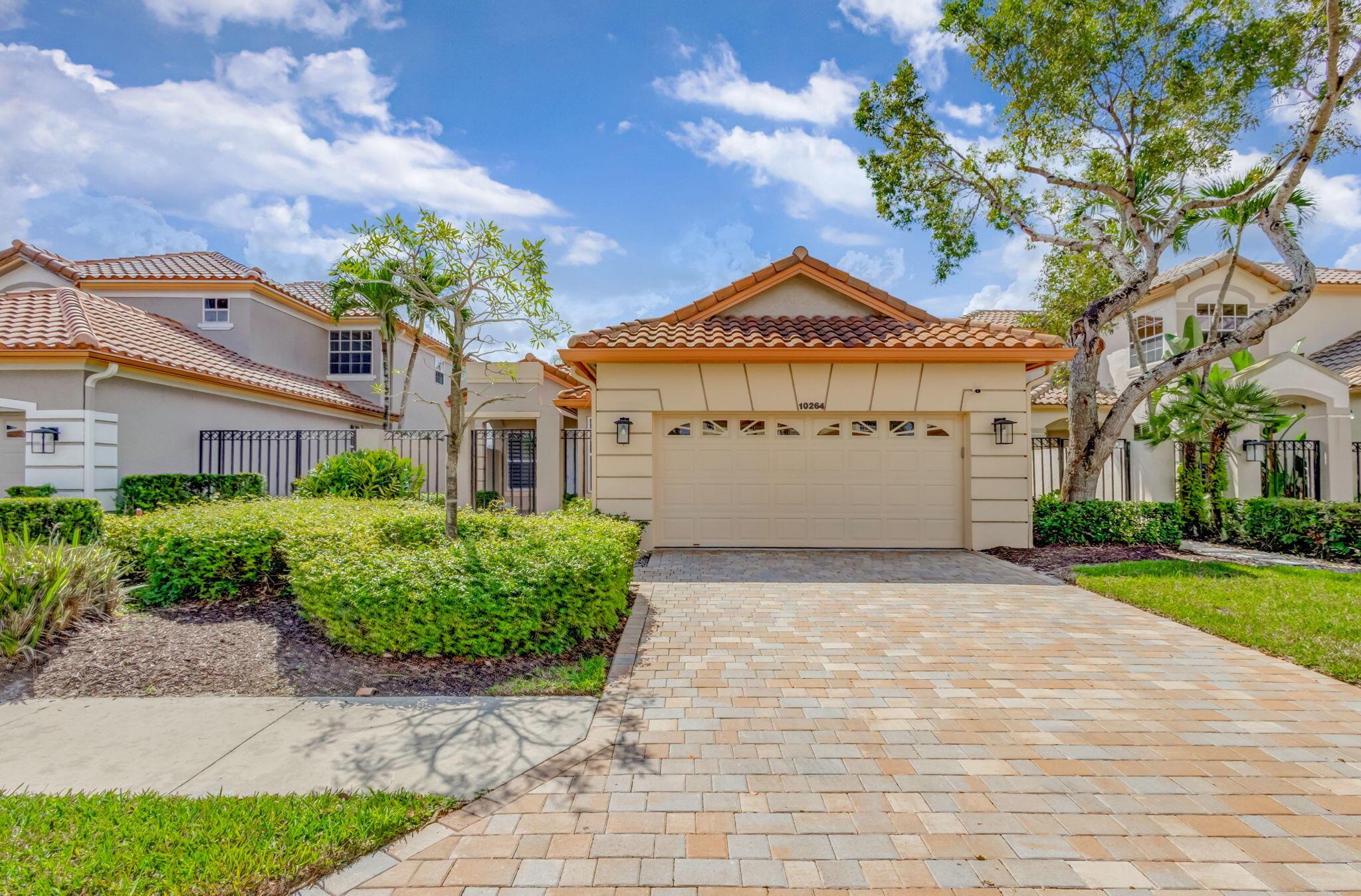 Premiere Membership Available .  Welcome to this beautifully renovated 4-bedroom, 3-bathroom single-family home, offering nearly 2,000 sq. ft. of modern living space. From the moment you step inside, you'll be captivated by the 3x3 porcelain tile flooring throughout, high ceilings, and an abundance of natural light.The gourmet kitchen , features white quartzite countertops with a waterfall edge, sleek cabinetry, and top-of-the-line finishes. Each bathroom has been tastefully remodeled to offer spa-like comfort and elegance.Designed for both relaxation and entertaining, this home boasts a spacious family room, a large dining area, and golf course views. from multiple vantage points. Additionally, the screened in pool and patio allows you to live the lifestyle you always dreamed of!