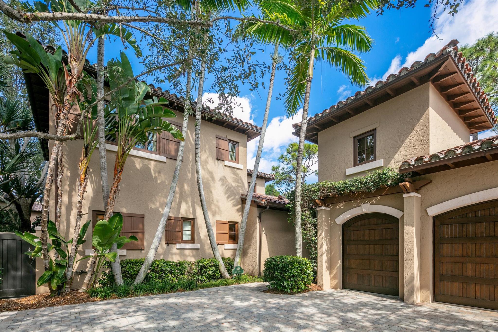 Welcome to 306 Villa Drive, one of the premier Club Cottages at The Bear's Club, Jupiter's prestigious golf community. For the avid golfer and discerning buyer seeking a unique and limited-edition home, this stunning villa is a true golfer's dream. Ideally located adjacent to the main clubhouse, 306 Villa Drive is an incredible 4 bed/4.5 bath Tuscan-style villa. Featuring a fabulous first floor master suite, the open floor plan is perfect for entertaining, including a large outdoor patio with built-in spa hot tub and outdoor kitchen area. Upstairs are three spacious bedrooms each with their own full bath. The Bear's Club is a world-class golf community known for providing the highest standards of quality and the finest amenities, programs and services to members and their guests.