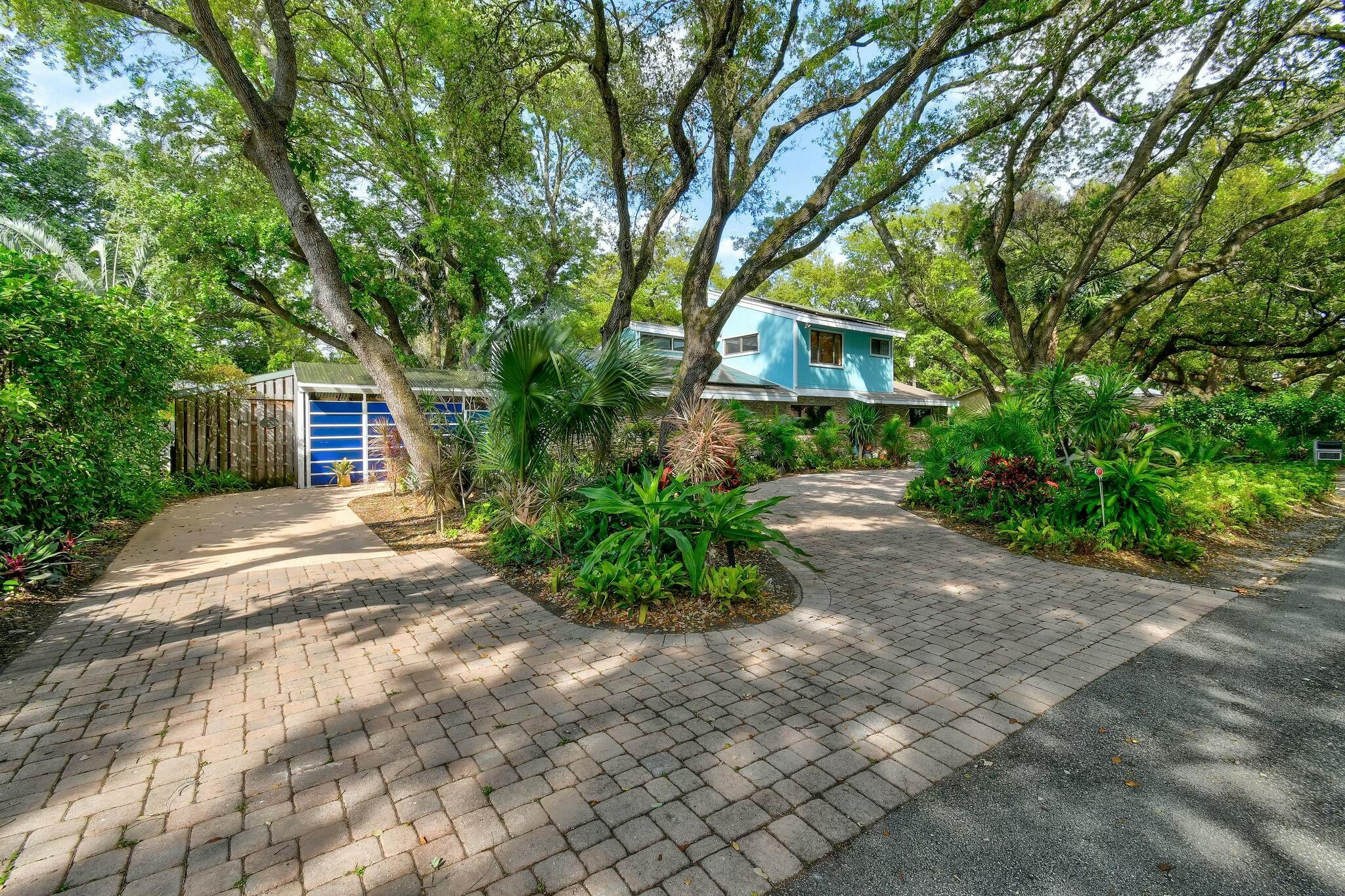 Live in Harmony with Nature in the Heart of Palm Beach Gardens!! This charming mid-century contemporary home, designed by the esteemed local architects Peacock & Lewis, seamlessly blends architectural design w/ the natural beauty of its surroundings. Offering 3 bedrooms, 3 bathrooms, + office, this home has been thoughtfully updated w/ a newer roof, fresh paint, a wraparound deck, and solar panels, which generate the home's electricity. Nestled on one of the most tranquil, canopied streets in the area, and just two homes away from the Intracoastal Waterway, this unique property features a striking exterior of natural stone. Surrounded by a lush oak hammock and vibrant native tropical landscapes, this home offers an exceptional living experience. Wake up to the serene sounds of (see more Wake up to the serene sounds of dozens of bird species, filling the air with a peaceful ambiance.
Located just minutes from the ocean, golf courses, and shopping, this tropical haven is perfectly positioned for both relaxation and recreation. Shopping at the Palm Beach Gardens Mall is just a short bike ride away, while world-class dining options are abundant in every direction. Outdoor enthusiasts will appreciate the proximity to Frenchman's Preserve Nature Park, located directly across the street, offering endless opportunities for exploration and enjoyment.
This rare and unique property in East Palm Beach Gardens presents an unparalleled opportunity to live in harmony with nature while being close to all that the area has to offer.