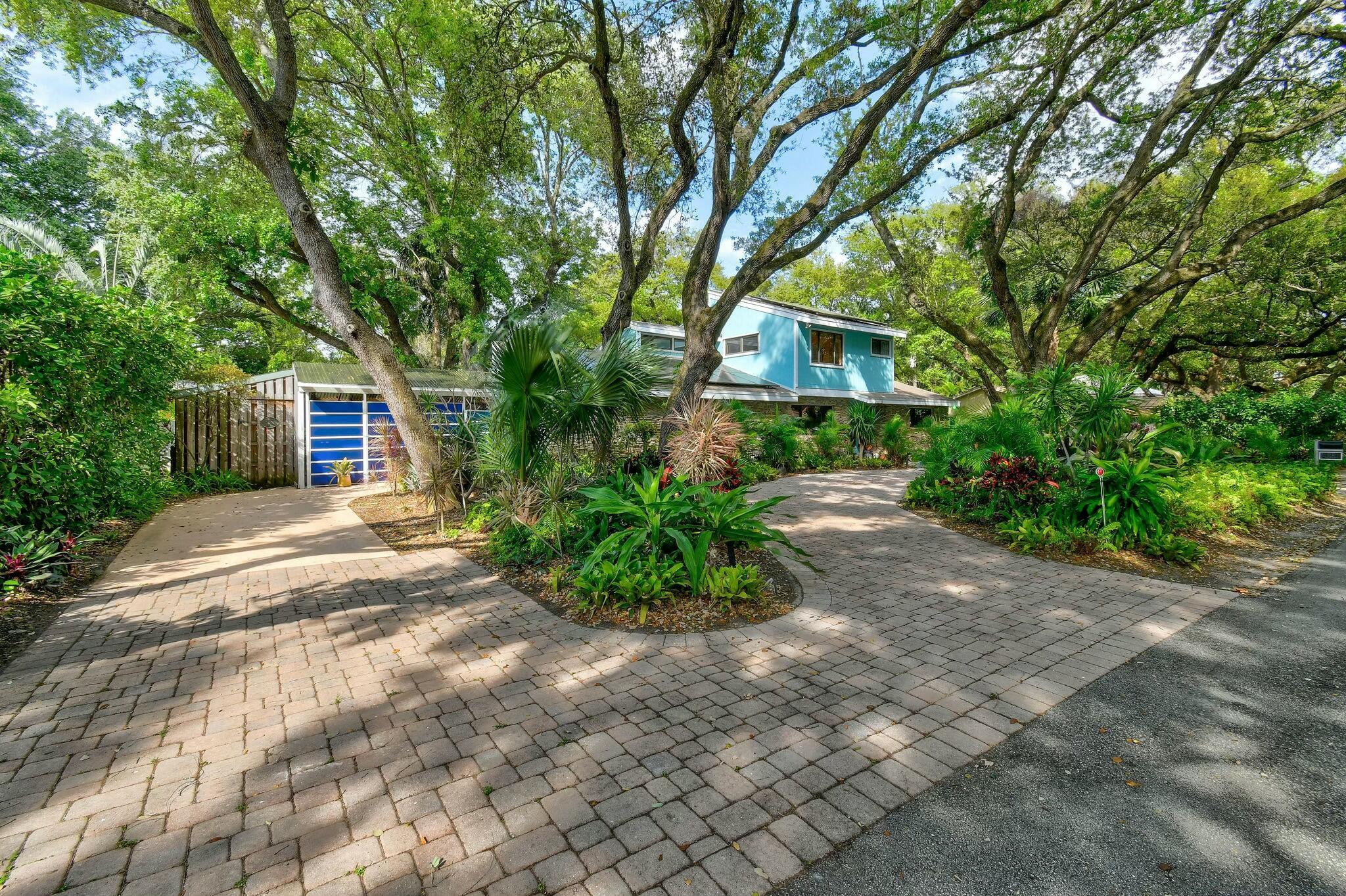 Live in Harmony with Nature in the Heart of Palm Beach Gardens!! This charming mid-century modern home, designed by the esteemed local architects Peacock & Lewis, seamlessly blends architectural design w/ the natural beauty of its surroundings. Offering 3 bedrooms, 3 bathrooms, + office, this home has been thoughtfully updated w/ a newer roof, fresh paint, a wraparound deck, and solar panels, which generate the home's electricity. Nestled on one of the most tranquil, canopied streets in the area, and just two homes away from the Intracoastal Waterway, this unique property features a striking exterior of natural stone. Surrounded by a lush oak hammock and vibrant native tropical landscapes, this home offers an exceptional living experience. Wake up to the serene sounds of (see more Wake up to the serene sounds of dozens of bird species, filling the air with a peaceful ambiance.
Located just minutes from the ocean, golf courses, and shopping, this tropical haven is perfectly positioned for both relaxation and recreation. Shopping at the Palm Beach Gardens Mall is just a short bike ride away, while world-class dining options are abundant in every direction. Outdoor enthusiasts will appreciate the proximity to Frenchman's Preserve Nature Park, located directly across the street, offering endless opportunities for exploration and enjoyment.
This rare and unique property in East Palm Beach Gardens presents an unparalleled opportunity to live in harmony with nature while being close to all that the area has to offer.