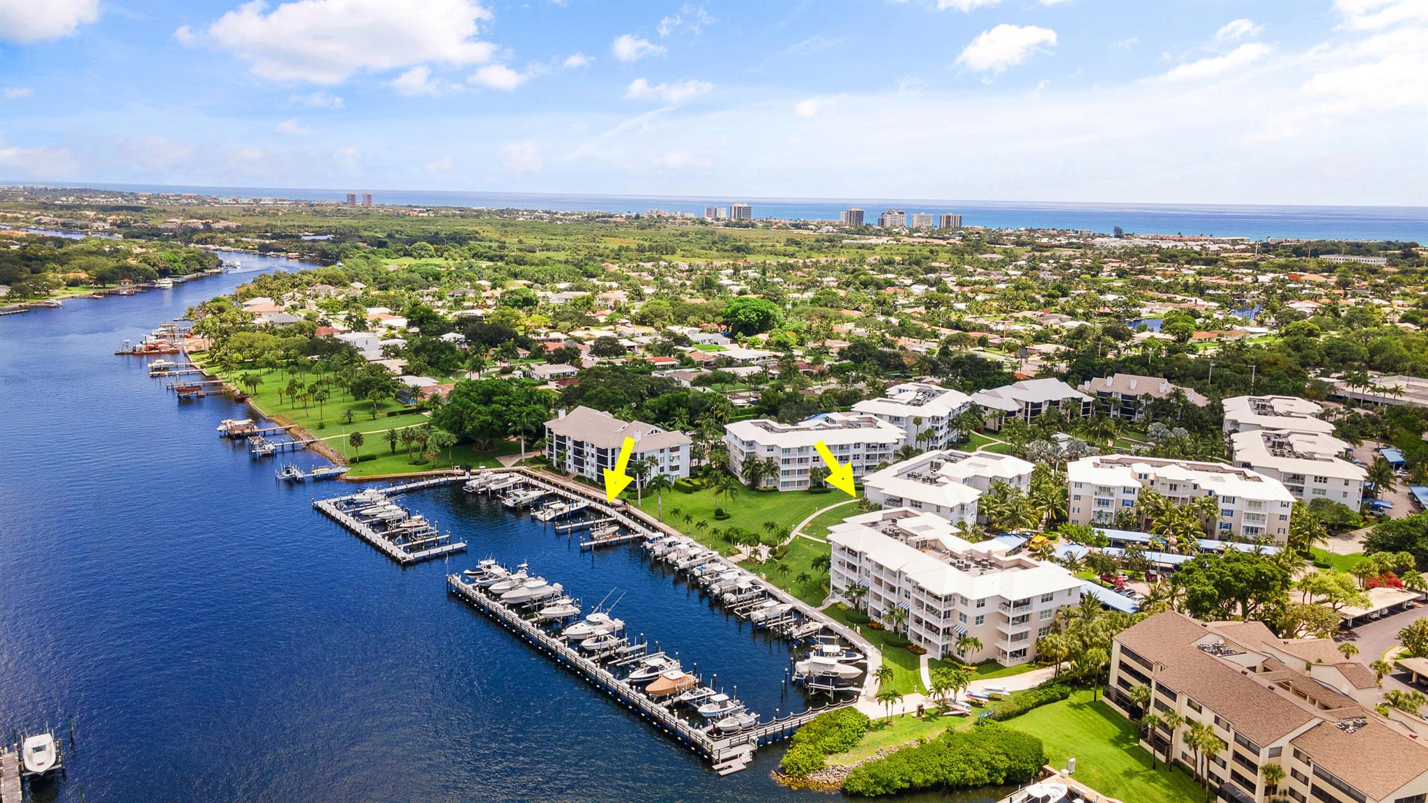Experience luxury waterfront living with stunning Intracoastal views from every window in this updated 2nd-floor condo. This bright, spacious home features private balconies, perfect for enjoying serene water views. The renovated kitchen features stainless steel appliances, Cristallo quartzite countertops, white wood cabinetry, a walk-in pantry, dine-in bar seating, & a bar area. New flooring flows throughout the main living areas & bedrooms. Lavish bathrooms include granite countertops & glass-enclosed showers. Additional features: impact glass, secure entry, extra storage, & a 2024 A/C.Resort-style amenities, including a private marina, pool, spa, tennis courts, & clubhouse.A premier deeded 51' x 19' boat slip with a new 50,000 lb lift is included. Located in a no-wake zone.