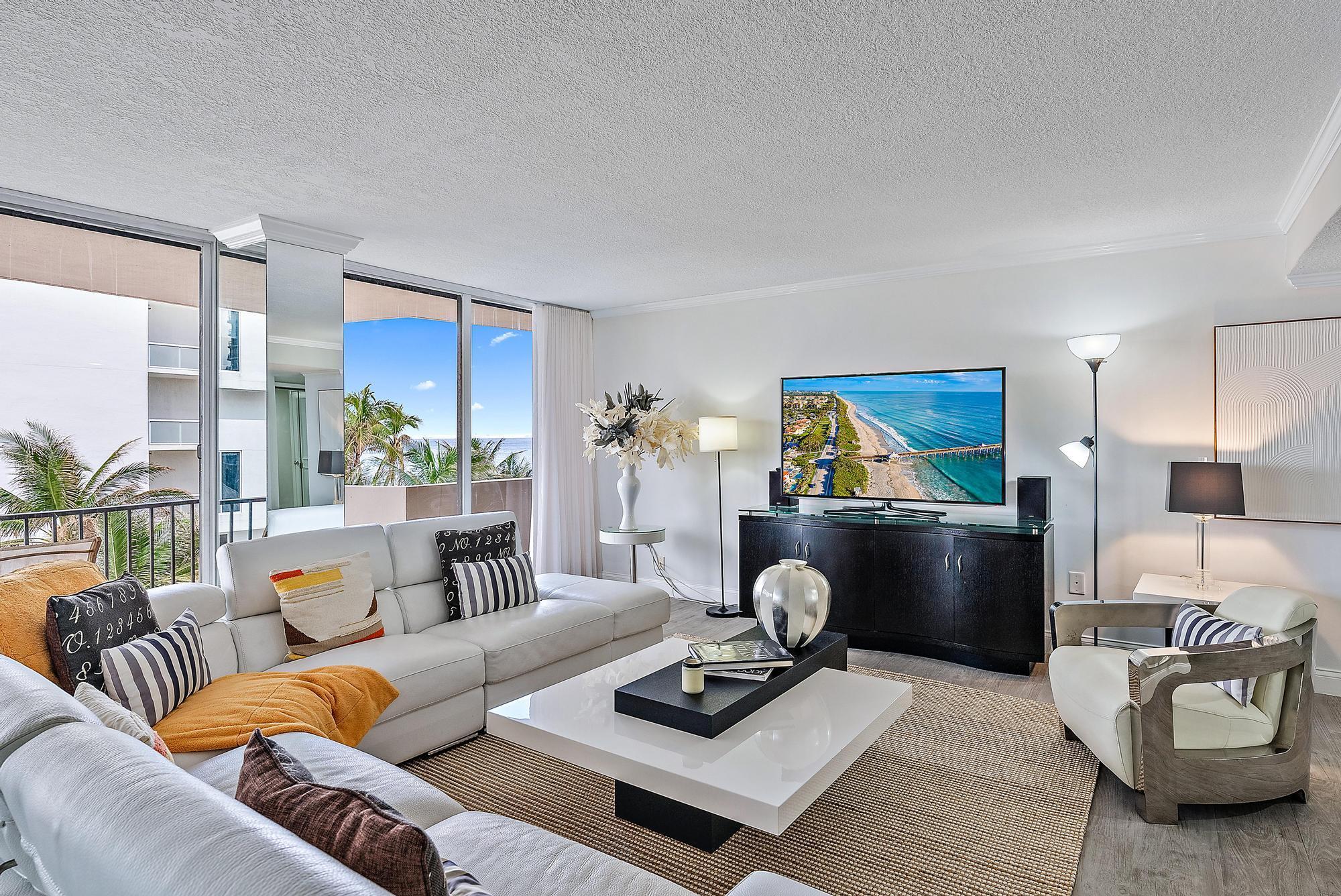 Priced to Sell!!  New Roof complete this week! Stunning Turn Key Furnished Condo with magnificents Oceanfront and Intracoastal views. Updated bathrooms and Kitchen with beautifull porcelain tile floors, Washer & Dryer, Water and Basic Cable is Included in HOA fees. Tower 1 is ocean side so you can walk to the Beach and enjoy our Sunshine State. Live in paradise all year or seasonally. You can also rent it to make this property work for you!  Condo is furnished and offered separately for purchase.Cote D'Azur has fob access to front gate & each tower. On-site manager M-Sat. Pool, grills & large outdoor social area between the two towers. Gym, community room, library & tennis / pickleball courts. 15 minutes to world class shopping, dining.