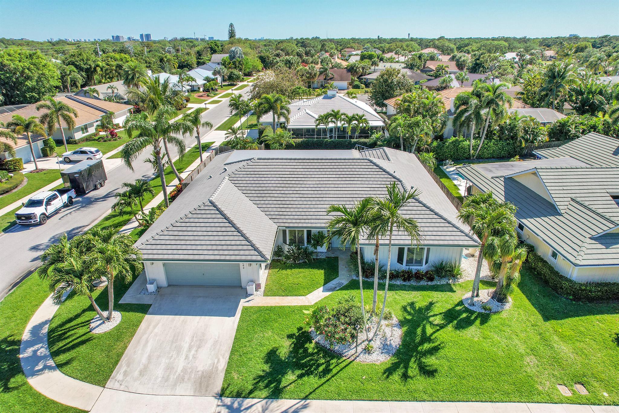 Frenchmen's Fancy!  Remodeled One-Story 3 Bedroom 3 Full Bathroom w/Den, Pool home in the Prosperity Corridor.  The house features a Gourmet kitchen with Quartz counters, SS appliances and 42'' cabinets. Tile flooring throughout. New Cement Tile Roof (2022), 2 AC's (2024, 2020), Vaulted Ceilings and Generous sized bedrooms.  Owners' suite has sitting area, large walk-in closet and Spa like Bathroom.  The outdoor living boasts a screened Lanai, Pool with fully fenced backyard and lush landscaping.  Frenchmen's Landing is a gated community with a gazebo and stocked pond. Fishing is allowed! Neighborhood Park, 2 tennis courts, and basketball court. Festive social events for every age throughout the year. Dream location in Prosperity Corridor, minutes to the Beach, 172 Acre Frenchmen's Forest