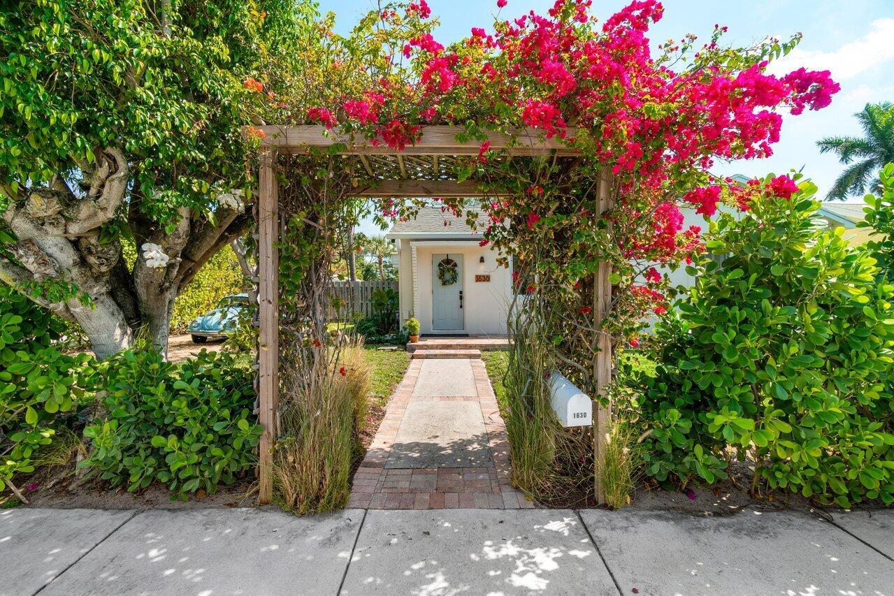 Palm Beach-Inspired Mid-Century Oasis - Minutes from the Beach!Welcome to this stunningly renovated mid-century gem, a true retreat nestled on an oversized fully fenced tropical lot in the heart of Lake Worth Beach. Thoughtfully updated to blend timeless charm with modern luxury, this home boasts exposed Dade County pine rafters, impact windows throughout, elegant crown molding, a newer A/C unit (2020), and a newer water heater (2022)--ensuring both comfort and efficiency. (SEE REMARKS) The brand-new kitchen is a showstopper, featuring crisp white shaker cabinetry, sleek quartz countertops and backsplash, Rejuvenation hardware, and a full suite of GE Profile stainless steel appliances. Enhanced by new lighting and fully finished ceilings, the home radiates warmth and sophistication.

A Private Outdoor Sanctuary: Step outside to a tranquil, lushly landscaped backyard designed for ultimate relaxation and entertaining. A beautiful brick patio is the perfect setting for al fresco dining, illuminated by new dusk-to-dawn caf+¬ lights and patio lighting. Towering mature trees, a flourishing mango tree, and five producing banana trees create a tropical paradise. After a day at the beach, rinse off in the outdoor shower, surrounded by lush greenery for a truly refreshing experience. The extra-long driveway provides ample parking for a boat or RV, and the home is also outfitted with discreetly placed 14 panel solar system, embracing sustainability without compromising aesthetics.

Flexible Living with an In-Law Suite: Designed for versatility, this home features a 2-bedroom, 1-bath main residence alongside a private 1-bedroom in-law suite complete with its own bath, kitchenette, and walk-in closet&#x14;perfect for extended family, guests, rental income, or a luxurious primary suite.

Unbeatable Location - Coastal Living at Its Best
Nestled just east of Federal Hwy, this home offers unparalleled access to the very best of Lake Worth Beach:

-5 minutes to downtown, where charming boutiques, art galleries, and vibrant local culture await
-Dining hotspots including Oceana, Paradiso, and the iconic Benny's on the Beach
-The soon-to-open Gulf Stream Hotel, an exciting new addition to the area
-Lake Worth Beach &amp; Pier for sun-soaked relaxation
-Lake Worth Beach Golf Club &amp; Palm Beach Par 3 Golf Course for world-class golfing
-A 15-minute bike ride to the ocean, where the soothing sounds of the waves and the scent of salt air remind you just how close you are to paradise
-A short drive to the iconic Worth Avenue in Palm Beach, renowned for its upscale shopping, fine dining, and elegant charm

This one-of-a-kind home offers the perfect balance of mid-century charm, modern amenities, and unbeatable location. Don't miss your chance to own a piece of Florida's coastal dream&#x14;schedule your private tour today!