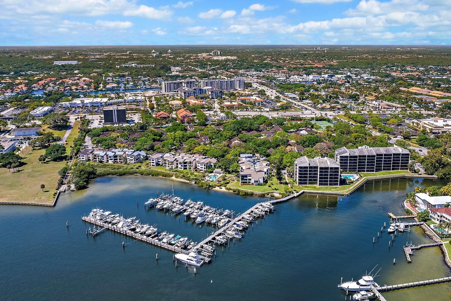 BOATER'S DREAM - DIRECT INTRACOASTAL VIEWS & 40FT SLIP! Experience unparalleled waterfront living in this rare first-floor residence--no stairs, just effortless access to the pool and waterway. Enjoy breathtaking Intracoastal views and the convenience of a 40ft boat slip, all within a highly desirable gated community.This impeccably appointed home features top-of-the-line appliances, including double ovens and an induction cooktop. The spacious primary suite boasts two closets, including a large walk-in for ultimate storage. Additional highlights include a newer hot water heater, a private storage room, and a 24-hour manned gate for peace of mind.With a low HOA that includes the boat slip, this is an exceptional opportunity for boating enthusiasts. Pet-friendly (one small pet