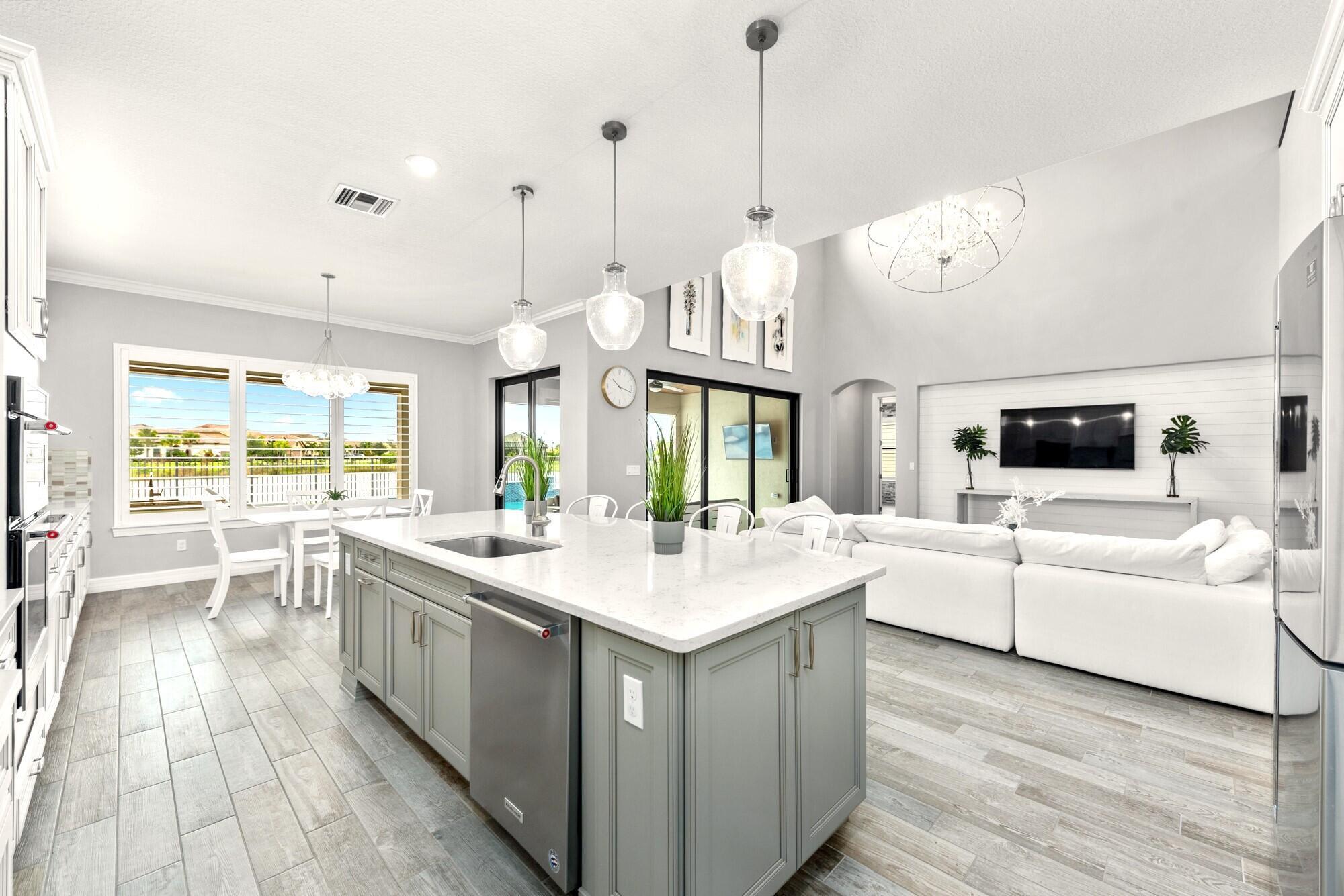 Enjoy breathtaking lake views from this stunning 2019-built home in the highly sought-after gated community of Sonoma Isles. This Expanded Garden Vista model offers an impressive 5,304 sq. ft. of living space with six bedrooms, six full bathrooms, and a half bath, along with a loft and a private theater room. Nestled in one of the most desirable and quieter locations in Sonoma Isles, this home is set furthest away from the turnpike, ensuring peace and privacy.Designed with luxury and elegance in mind, this home is filled with high-end designer upgrades. The interior boasts upgraded porcelain tile flooring, engineered wood upstairs, a striking circular staircase, and soaring coffered ceilings. The gourmet kitchen features custom cabinetry and quartzite countertops,...... KitchenAid appliances, a 5 burner gas cooktop, walk in pantry, butler's pantry.  Enjoy the beautiful outdoors with brand new salt-water pool with spa and bubblers and custom lighting.  The covered patio features an extra extended patio, outdoor kitchen with BBQ grill, sink, huge outdoor area for entertaining, beautiful pool spa fenced all around with lush landscaping and stunning lake views.
Sonoma Isles offers a spectacular Jupiter lifestyle and great location immediately adjacent to Jupiter Country Club (and golf membership is available) in the top-rated Palm Beach County/Jupiter Schools.  It's a newly built construction community with a Guard House &amp; Gated Entry that is Virtually Manned 12 Hours per day! The Recreation Center has a Resort Style Swimming Pool, a Fire Pit, BBQ Grill, a Playground, Tennis Courts &amp; Clubhouse with a Fitness Center, Community Gathering Room, a Catering Kitchen, an Activity Room &amp; a Mail Room! The neighborhood features pristine lake views from nearly homesite, the latest consumer inspired home designs, wide walkways and streets with many lights and lush landscape surroundings. All included in the low HOA Monthly Fee plus the Lawn &amp; Landscape Maintenance &amp; Front &amp; Back Irrigation! With its prime location, just across from Jupiter Country Club, this Community is 15 Minutes from the Beaches along the Atlantic Ocean plus the Restaurants &amp; the Shopping of Jupiter! The A Rated Schools make Sonoma Isles a Great Place for Families!
