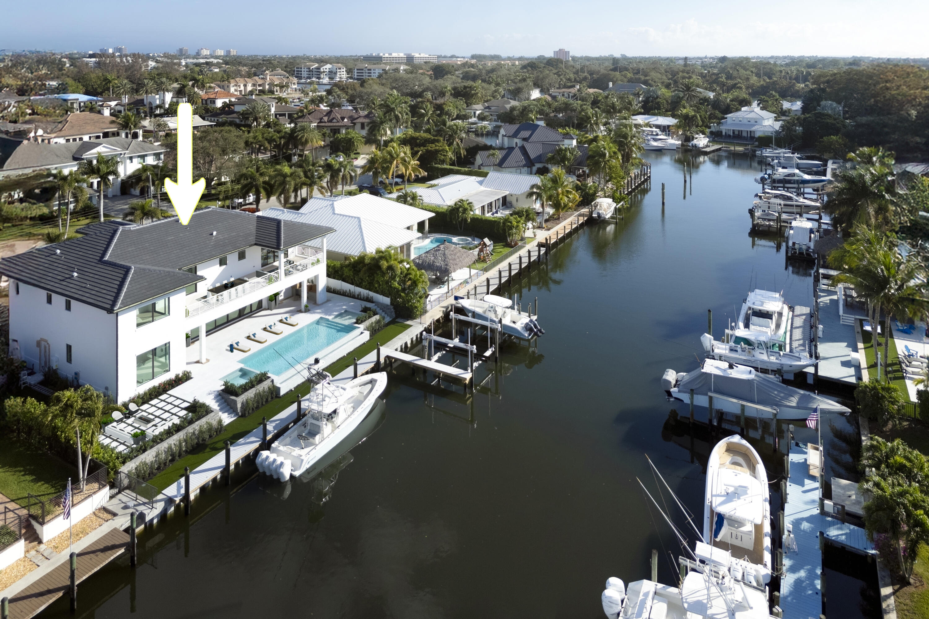 This extraordinary new-construction waterfront estate offers a refined lifestyle of sophistication, elegance, and seamless indoor-outdoor living. Designed with meticulous craftsmanship and cutting-edge architecture, the residence spans 6,504 square feet of living space and 8,465 square feet in total. Every detail has been carefully curated to provide an atmosphere of effortless luxury in one of Palm Beach Gardens' most sought-after waterfront communities. With direct ocean access and no fixed bridges, this property is a boater's paradise, offering 95 feet of prime water frontage on a deep, extra-wide canal. The estate combines breathtaking water views, a contemporary coastal aesthetic, and state-of-the-art technology, making it the perfect retreat for those seeking both luxury and convenience.
A dramatic entryway welcomes guests into a grand, open-concept living space, where floor-to-ceiling sliding glass doors allow natural light to flood the interior. The great room and dining area create a seamless flow, designed for both intimate gatherings and large-scale entertaining. High ceilings and custom-built features enhance the sense of grandeur, while stunning waterfront views provide an elegant backdrop to everyday living.
The gourmet chef's kitchen is a masterpiece of design and functionality, equipped with top-of-the-line appliances, including a Wolf gas range, 30" convection Wolf microwave, Subzero refrigeration, two Cove dishwashers, and Cristallo waterfall-edge countertops. Custom oak cabinetry and a concealed butler's pantry with additional refrigeration, a Miele coffee station, and a Viking microwave offer both beauty and practicality. This kitchen is designed for those who appreciate fine dining and entertaining in effortless style.
The primary suite is a private sanctuary, offering expansive his-and-her walk-in closets, a spa-inspired bathroom with dual showers, a soaking tub, and Taj Mahal countertops. A morning bar with a Subzero beverage cooler and Miele coffee station adds a layer of convenience, while private balcony access provides serene waterfront views. Thoughtfully designed with comfort in mind, this retreat embodies tranquility and sophistication.
Designed for outdoor entertaining, the backyard offers a resort-style oasis with a 50-foot heated saltwater infinity pool and spa, marble paver decking. Covered verandas on both levels provide shaded areas for relaxation, complemented by ceiling fans that bring a cool tropical breeze. A fully equipped summer kitchen with a built-in gas grill, sink, and refrigerator ensures effortless outdoor dining.
For the avid boater, this property offers an exceptional waterfront experience. A newly constructed seawall with batter piles and heavy-duty Vanguard sheet piles ensures durability, while the 70-foot composite dock and 30,000-pound High-Tide boat lift with quad motors provide the ultimate convenience. With no fixed bridges and direct access to the Intracoastal Waterway just 350 yards away, this home offers one of the finest boating locations in South Florida.
Luxury extends beyond design with smart-home technology and high-end features throughout. The estate includes an air-conditioned bonus room perfect for a tackle room or gym, two oversized two-car garages with 13-foot ceilings to accommodate car lifts, and two laundry rooms equipped with double LG washer and dryer pairs, a freestanding steamer, and custom cabinetry. Large-format Italian porcelain tile flooring downstairs and hand-scraped engineered wood upstairs add warmth and style, impact-resistant hurricane windows and doors, and a dual-zone climate-controlled 489-bottle wine cellar enhance both security and comfort. Generator-ready infrastructure with installed transfer switches.
Palm Beach Gardens offers a lifestyle of prestige, combining luxury waterfront living with world-class golf courses, fine dining, and exclusive shopping. Pristine beaches, elite yacht clubs, and convenient access to Palm Beach International Airport make this location one of the most desirable in South Florida. Whether as a primary residence or seasonal retreat, this home presents an unparalleled opportunity to experience coastal living at its finest.
This brand-new waterfront estate is designed for those who demand the best in craftsmanship, location, and lifestyle. With a one-year builder warranty included, this is an investment in both luxury and lasting value.