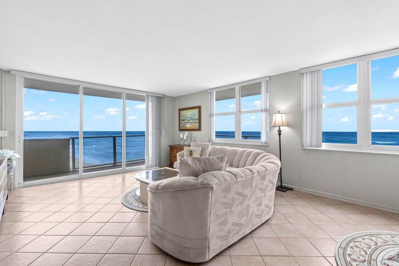 Direct oceanfront 2 BR, 2BA condo, corner unit w/wrap around balcony & impact glass, ocean view from all living areas & bedrooms! Easy access to private beach Beautifully remodeled kitchen 3 yrs ago w, quartz, Italian marble backsplash, dishwasher only used twice, Frigidaire appliances, walk-in pantry. Light & bright, tile thru-out, blinds, stackable w/d (not shown on floor plan) plus community laundry on each floor. Aug 2024 commercial grade ac (outside unit). Available furnished, 3 new TVs. Assigned covered parking spot. Heated community pool, social room w/kitchen, gym w/ sauna & his/her showers, grill, seawall, bike storage, paddle board storage, garbage shoot. 5 miles of beach w park access. New roof installation to begin April 2025, seller already paid $2,000 assessment due 5/2025!