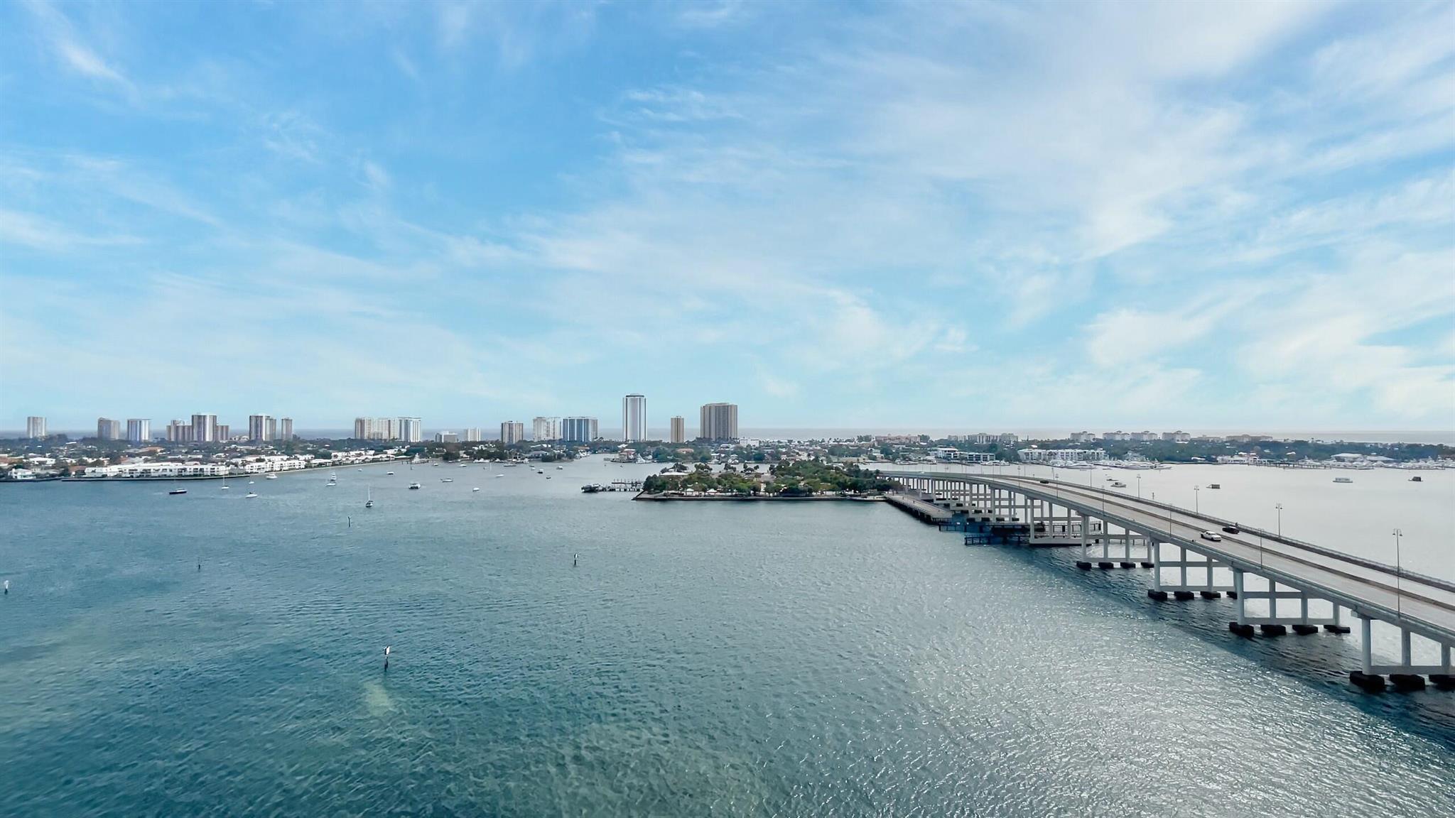 Come see the AMAZING expansive intracoastal and ocean views from this desirable 17th floor home. SPACIOUS  3 bd 3 1/2 bath condo includes 9ft hurricane impact floor to ceiling sliders and windows, authentic large marble floors throughout, NO CARPET,  new base and door casing through-out, new toilets, fans, frameless shower door, newer washer/dryer and more! Contemporary kitchen w  newer SS appliances, coordinating  designer backsplash. Assigned garage parking and climate-controlled storage unit. HOA includes 24 hr. security, cable, internet, valet, water, sauna & steam rm, fitness center, pool, hot tub, tennis/pickle-ball courts, billiard rm, social rm. Publix steps away & full service marina adjacent to the complex. This complex is the best hidden gem in Palm Beach County!!