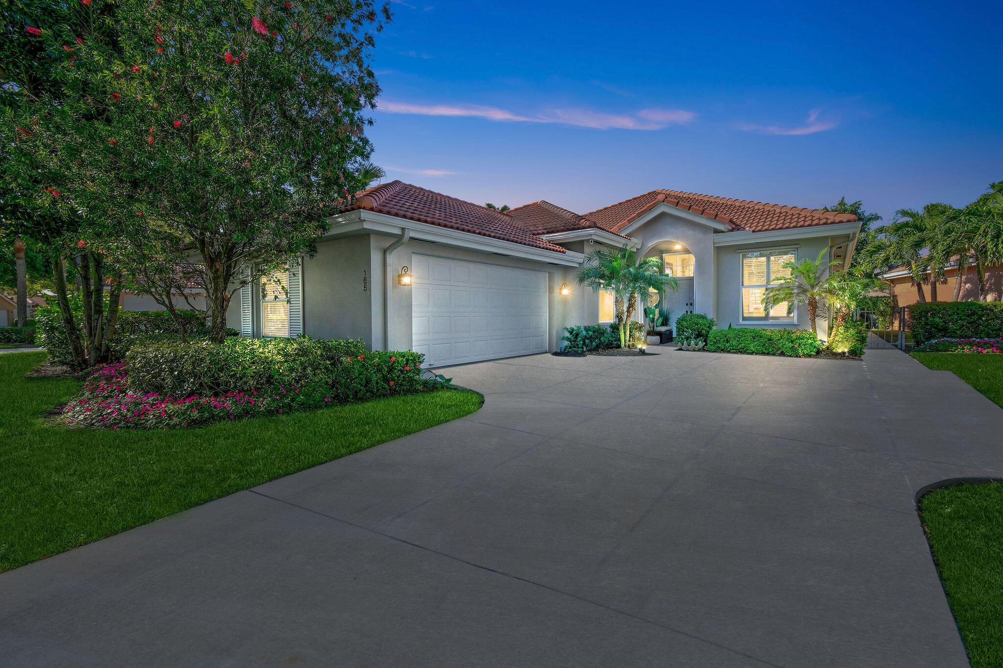 Nestled in the highly sought-after Hamptons of Jupiter, this DiVosta-built lakefront home has been meticulously renovated to offer modern luxury and effortless living. From the moment you step inside, the light and airy design creates an inviting atmosphere, perfect for entertaining. The stunning kitchen is a chef's dream, featuring an oversized quartz island, a kitchen nook ideal for a coffee bar or bistro set, and high-end finishes that seamlessly blend style and functionality. It includes a brand-new LG refrigerator and newer KitchenAid appliances, including an induction cooktop. The kitchen is further enhanced with soft-close drawers in all cabinets, providing a sleek and modern touch. Thoughtfully designed custom window treatments, plantation shutters, and LED lighting enhance the space, while wood-like luxury vinyl flooring flows throughout the entire home, adding warmth and durability.  

The spacious master suite provides a serene retreat, complete with brand-new impact windows, soaring ceilings, and built-in closets. The luxurious master bath features a skylight, a striking stone accent wall, a frameless glass shower with pebble flooring, a soaking tub, a towel warmer for added comfort, and additional storage with pull-out drawers separate from the vanity. The additional bedrooms offer generous space and built-in storage, while the renovated guest bath showcases modern finishes. A brand-new impact front door, new plumbing, a Nest system, and a brand-new A/C ensure both comfort and efficiency.  

This home is also equipped with a Pentair water purification system, providing high-quality, filtered water throughout. Situated on a fenced lakefront lot with room for a pool, this home is surrounded by lush green space, offering the perfect backdrop for outdoor living.  

Located just minutes from top-rated schools, parks, dining, shopping, and Jupiter's pristine beaches, this home offers the best of coastal living with modern convenience. Whether you're looking for a peaceful retreat or an entertainer's dream, this stunning residence is move-in ready and waiting for you to make it your own. Don't miss this rare opportunity to own a fully renovated home in one of Jupiter's most desirable communities&#x14;schedule your private tour today!