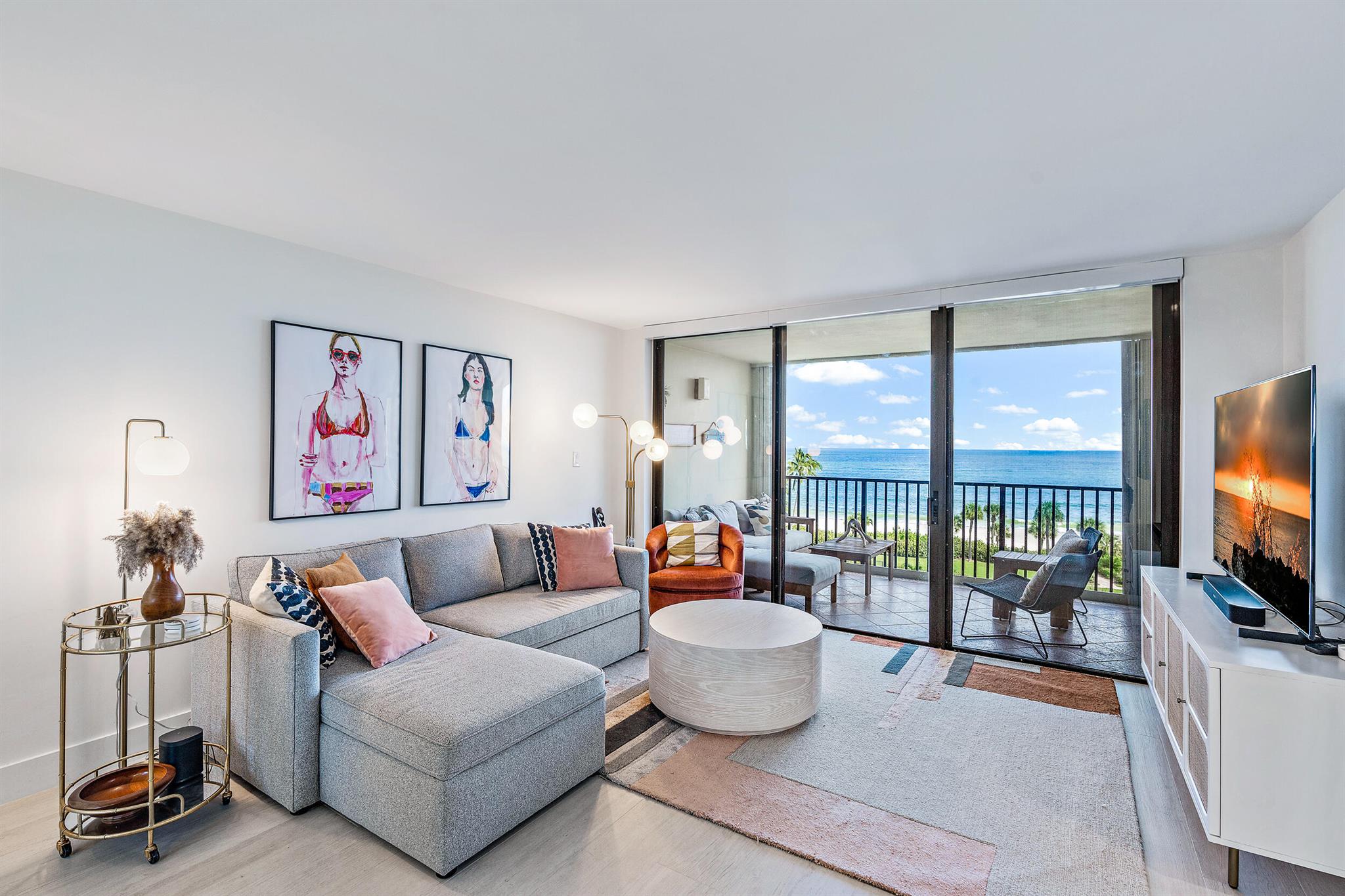 Have you been searching for the PERFECT, OCEANFRONT, TURNKEY, condo with amazing OCEAN VIEWS? This is it! In the highly desirable condos of Ocean Trail, this IMMACULATE and fully furnished, 2 bedroom, 2 bathroom condo perfectly combines the art deco and coastal styles to make you wonder why you would live anywhere else!From the moment you step through the front door of your BEAUTIFUL South Florida retreat, you are welcomed with abundant NATURAL light and an open living concept! To your right, you have a GOURMET white kitchen, equipped with a Subzero fridge and freezer, a premium coffee maker, and cocktail bar perfect for winding down at the end of the day! The kitchen also features ample counter and storage space along with a wood block center island! Off of the kitchen you also have an enclosed room that stores your washer and dryer!

As you continue into the home, you have a SPACIOUS dining room, large living room with a couch that converts into a pop-up queen size bed, and both living spaces flow effortlessly to your BEACH facing covered patio and outdoor living space!

The LARGE guest bedroom and bathroom feel like a LUXURIOUS primary suite, featuring a private balcony, top of the line fixtures, a premium mattress PLUS a futon for additional guests. 

The RESORT STYLE primary bedroom features a king size bed, beautiful ensuite, in-suite double vanity, and attached balcony overlooking the SPARKLING BLUE ocean!
Live the EASY South Florida resort lifestyle with all of the amenities you want and more!
This BEAUTIFUL and UPDATED 2 bedroom, 2 bathroom beach retreat sleeps up to 8 people comfortably and comes with an IN-UNIT washer &amp; dryer, High-Definition Smart TVs and Sonos Sound Systems in each room, motorized/remote controlled shades on all windows/sliding doors, including blackout shades in bedrooms, and a voice-controlled thermostat!
Property amenities include a manned-gate, premium covered parking, tennis/pickleball courts with tennis pros on staff, access to two pools, two hot tubs and two dry saunas, multiple outdoor grills, public golf course adjacent to property and day spa available at the next door resort.
Don't miss your opportunity to own this Coastal, Art Deco, OCEANFRONT beauty!