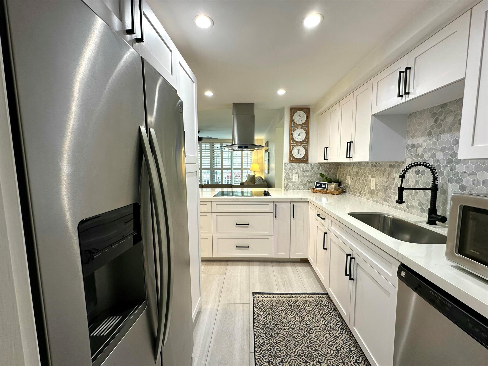 This beautifully renovated property offers the perfect blend of elegance and functionality. Featuring gorgeous white shaker cabinets and luxurious quartz countertops, complete with stainless steel appliances for a sleek, modern look. The open-concept design flowseffortlessly into the living areas, where porcelain wood-look tile flooring adds warmth and sophistication. The bathrooms have been thoughtfully updated with his and her vanity shaker cabinets, quartz countertops and sleek Blackstone showers, eliminating bath tubs for a contemporary, spa-like experience. For peace of mind, the condo is equipped with impact protection throughout, ensuring safety and durability. Enjoy the soothing sounds of the waves from your balcony. A true gem that perfectly balances style and comfort!