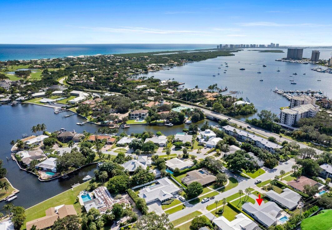 Discover unparalleled luxury in the highly sought-after Hidden Key - Gated and No HOA - neighborhood, where serene living meets the convenience of a prime location. Perfectly nestled across from the Intracoastal Waterway and just moments from pristine beaches, this pool home offers the ultimate Florida lifestyle. With shopping, dining, and the renowned JD McArthur State Park just around the corner, you're at the heart of it all. Step inside this beautifully updated residence and prepare to be impressed. A brand-new roof crowns the home, while impact doors and windows provide both safety and style. The centerpiece of the home is the expansive gourmet kitchen, reimagined with sleek stainless steel appliances, stunning quartz countertops, and ample space to fuel your culinary creativity. Each bedroom has been thoughtfully designed as a personal oasis, combining modern elegance with cozy tranquility. The attention to detail continues outdoors, where you'll find a professionally landscaped yard, a newly installed heated saltwater pool, and a private retreat perfect for entertaining or relaxing.

This is more than just a house&#x14;it's your own slice of paradise. Schedule your private tour today and start living the life you've always dreamed of in North Palm Beach!