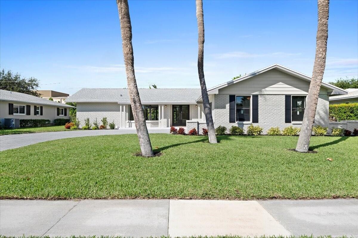 Discover unparalleled luxury in the highly sought-after Hidden Key - Gated and No HOA - neighborhood, where serene living meets the convenience of a prime location. Perfectly nestled across from the Intracoastal Waterway and just moments from pristine beaches, this pool home offers the ultimate Florida lifestyle. With shopping, dining, and the renowned JD McArthur State Park just around the corner, you're at the heart of it all. Step inside this beautifully updated residence and prepare to be impressed. A brand-new roof crowns the home, while impact doors and windows provide both safety and style. The centerpiece of the home is the expansive gourmet kitchen, reimagined with sleek stainless steel appliances, stunning quartz countertops, and ample space to fuel your culinary creativity. Each bedroom has been thoughtfully designed as a personal oasis, combining modern elegance with cozy tranquility. The attention to detail continues outdoors, where you'll find a professionally landscaped yard, a newly installed heated saltwater pool, and a private retreat perfect for entertaining or relaxing.

This is more than just a house&#x14;it's your own slice of paradise. Schedule your private tour today and start living the life you've always dreamed of in North Palm Beach!