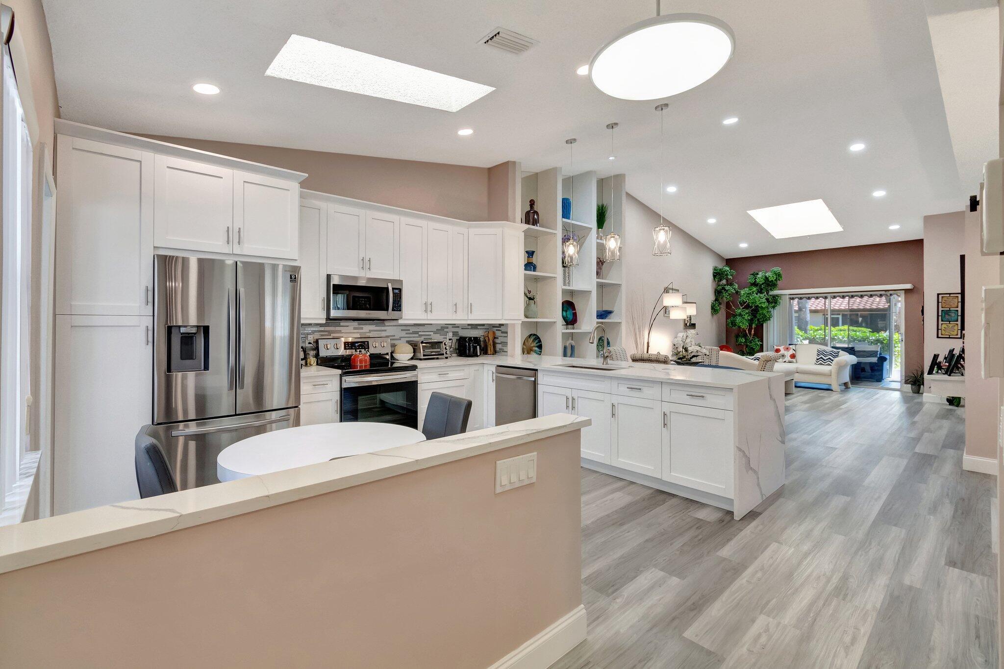 HUNTINGTON POINTE--SUPER ACTIVE ADULT COMMUNITY.Experience the epitome of modern luxury at 6100 Waldwick Circle, a prestigious address in the heart of Delray Beach, Florida. This immaculately renovated villa, model 'Monaco,' stretches across a generous 1,638 LivSqFt, providing ample space for comfort and style, complacent with a one-car garage and a spacious two-car driveway.Proudly standing as a testament to elegance and class, the villa showcases remarkable architecture complemented by beautiful baseboards and illuminated by natural light ushering in through two expansive skylights. The living quarters include two capacious bedrooms, a versatile den with a large window, and two remarkably finished bathrooms. An impressive dual-entrance patio adds a unique charm either accessed via the living room or directly from the master bedroom. Space is impressively planned, with the master bedroom boasting of two vast walk-in closets.

The interior does not fall short of luxury and sophistication. All walls are seamlessly finished, enhancing the overall aesthetic charm of the villa. A breathtakingly beautiful kitchen features quartz countertops with waterfall edges, brand-new cabinetry, a capacious oversized sink, and an assortment of high-end stainless steel appliances. An inviting window and eat-in space complete the pleasing kitchen landscape. Your humble abode is designed with soft-closing kitchen cabinets, proof of attention to minute detailing, and a convenient lazy Susan, all contributing to eased living.

The villa also incorporates a separate laundry section with a time-saving pocket door, a window, and high-end washing appliances. An impact-rated garage door adds an extra layer of safety.

The guest-facing portions of this property have been given the same attention to detail. The guest bathroom features a shower-tub combo and window showcasing two closets, a walk-in, and a linen closet in the hallway. The guest bedroom indulges with two windows and a nice, deep closet.

The entire villa, including the under-air patio space, is elegantly laid with luxury vinyl flooring, which contributes to the refined ambiance.

The centerpiece, the master bathroom, radiates a regal aura highlighted by a single vanity quartz countertop, a stunning step-down shower, a window, valuable linen closet storage, and elegant flooring.

Join us at this splendidly renovated villa catered to your premium tastes, where every step offers an encounter with luxury. Reside at 6100 Waldwick Circle, a prestigious domain that mirrors the grandeur of the illustrious Delray Beach Huntington Pointe community, for an unparalleled, elegant living experience.

Huntington Pointe is an active community in the heart of Delray Beach, with a 24/7 manned gate.

The clubhouse has been renovated and provides residents with endless activities.


It is a diverse entertainment complex with an indoor and lakeside Olympic pool, three satellite pools, and a convenient cafe on site, perfect for great breakfasts and lunches.

Residents can participate in special interest clubs and attend fitness classes. The state-of-the-art fitness center includes aerobics and dance studios, a heated indoor pool, a spa, and a sauna.

Outdoor activities include pools, pickleball courts, tennis courts, bocce ball, shuffleboard courts, and a putting green.

The on-site Village Cafe serves breakfast and lunch seven days a week.

Huntington Pointe is only 15 minutes from downtown Delray Beach and the ocean. If you're in the mood for movies, bowling, outdoor restaurants, and shops, you can head to Delray Market Place, only five minutes away.

This 24-hour gated community offers a stress-free lifestyle perfect for snowbirds and full-time residents.

AC TRANE 2007
HWH-2013
HOA-MONTHLY---covers water, basic cable, and internet.
BLUE STREAM Fiber&#x14; underground wires
INTERNET&#x14;whole home WiFi with speeds up to 1 Gbps
TV&#x14;300+ channels, TiVo &amp; Google TV, Network DVR.
The association covers the fire alarm service, but the resident is responsible for the burglar alarm service.