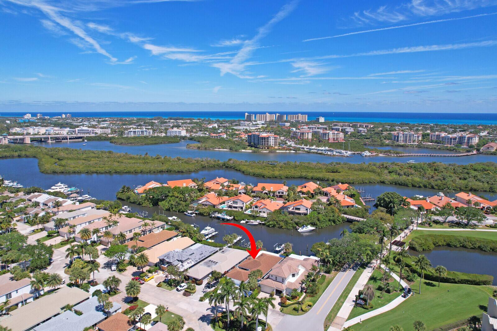Discover luxury waterfront living in the prestigious gated community of Jonathan's Landing with this beautifully renovated three bedroom home. Designed for both luxury and convenience, this coastal retreat spans 2,149 sf and offers ocean access with no fixed bridges. Boating enthusiasts will appreciate the new constructed private dock with a wide-water approach for easy docking and room for a 40' boat, fresh water hose, a newly installed 12,000 lb hi-tide boat lift & recently elevated sea wall. Inside, the home showcases new wood-like tile flooring and an airy, open-concept design bathed in natural light. At the heart of the home, the gourmet kitchen features an oversized center island, white quartz countertops, custom cabinetry, stylish wine bar, and new stainless-steel appliances. More: elevate both comfort and efficiency. The highlight of the outdoor space is an expansive covered patio with a built-in hot tub, lush landscaping, and maintenance-free turf with tranquil water views. This property also boasts an oversized two-car garage, private outdoor shower, and a spacious driveway with ample guest parking. Jonathan's Landing is a premier country club community with extensive amenities, including 10 Har-Tru tennis courts, Bocce and pickleball courts, a full-service wellness center with a spa, a 257-slip marina, playgrounds, various dining options, and three championship golf courses. Membership is optional. Jupiter is known for it's beautiful beaches &amp; waterways, upscale dining, shopping, world-class golf, marinas, the Jupiter Inlet, Roger Dean Stadium, and is only a short drive to PBI Airport.