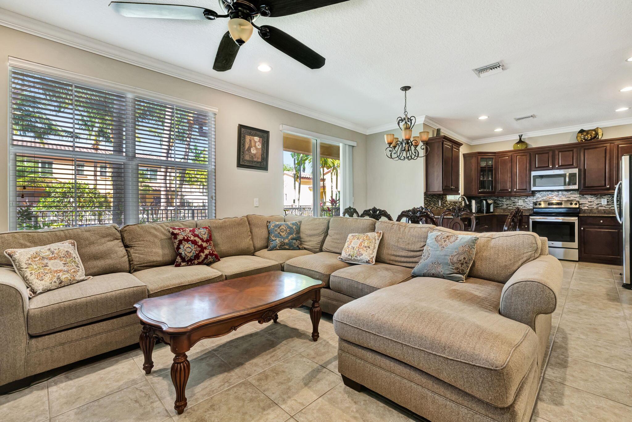 Motivated sellers. Enjoy luxury living in this spacious, secure townhouse with a beautiful view of the pool. The unit has a one car garage on each side of the unit. The community is gated, there is a security system, 24/7 camera monitoring at the gate and across community areas, offering an extra layer of protection. The unit has all impact glass, the kitchen has 42 inch cabinets with crown molding all through the unit, granite countertops, decorative backsplash, stainless steel appliances. The unit has a HUGE master bedroom, with additional split bedrooms with a jack and jill bath.