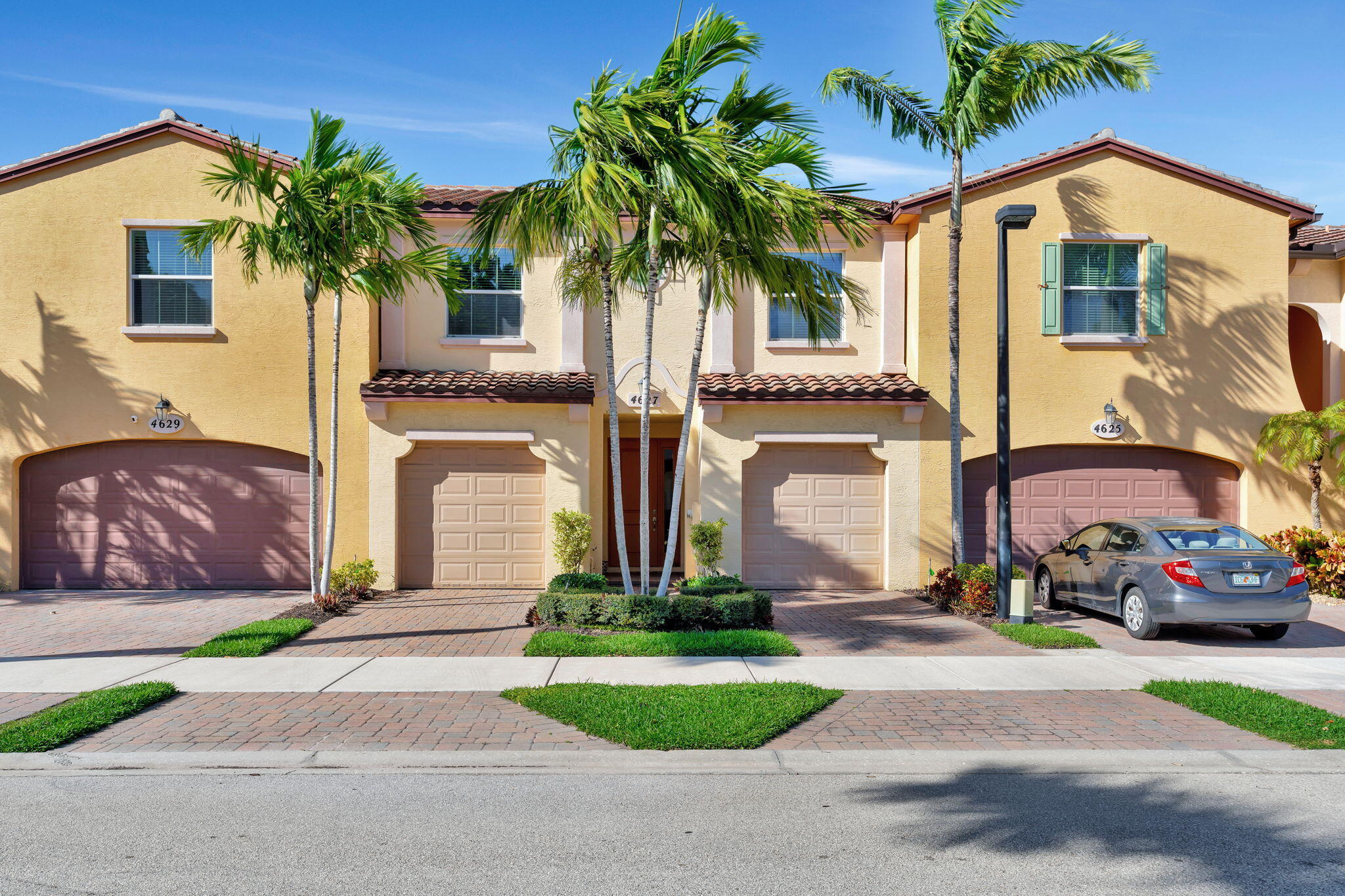 Motivated sellers. Enjoy luxury living in this spacious, secure townhouse with a beautiful view of the pool. The unit has a one car garage on each side of the unit. The community is gated, there is a security system, 24/7 camera monitoring at the gate and across community areas, offering an extra layer of protection. The unit has all impact glass, the kitchen has 42 inch cabinets with crown molding all through the unit, granite countertops, decorative backsplash, stainless steel appliances. The unit has a HUGE master bedroom, with additional split bedrooms with a jack and jill bath.