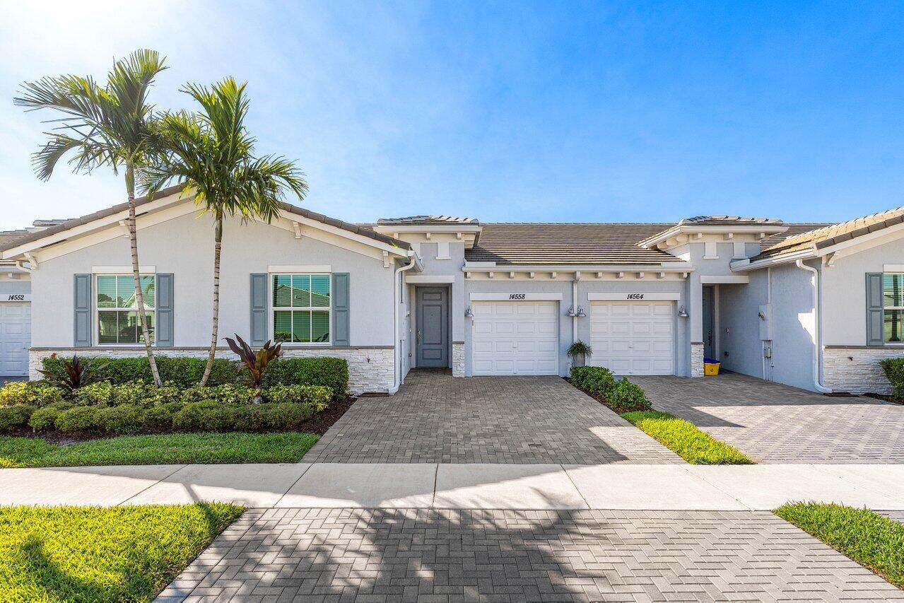 Live Like You are on Vacation in this Stunning 2 Bedroom Villa in one of the Newest Active Adult Communities in Delray. This Home Boasts IMPACT GLASS Throughout. Entering this Bright Home with Southern Exposure Notice the Stunning Lake Views out Back. The Gorgeous Kitchen Boasts Quartz Counters, S.S.  Appliances and Wood Cabinets. There are Wood Look Tile Floors Everywhere, The Massive Great Room Creates a Comfortable Living Space and there are Sliders to the Back Patio Overlooking Three Separate Lakes. The Primary Bedroom has a Huge Walk-In Closet and Luxurious Bathroom. The Split Bedroom Plan Creates Privacy in the Second Bedroom. Just Move Right in and Begin Living the Florida Lifestyle! Walk to the Incredible Amenity Filled Clubhouse!