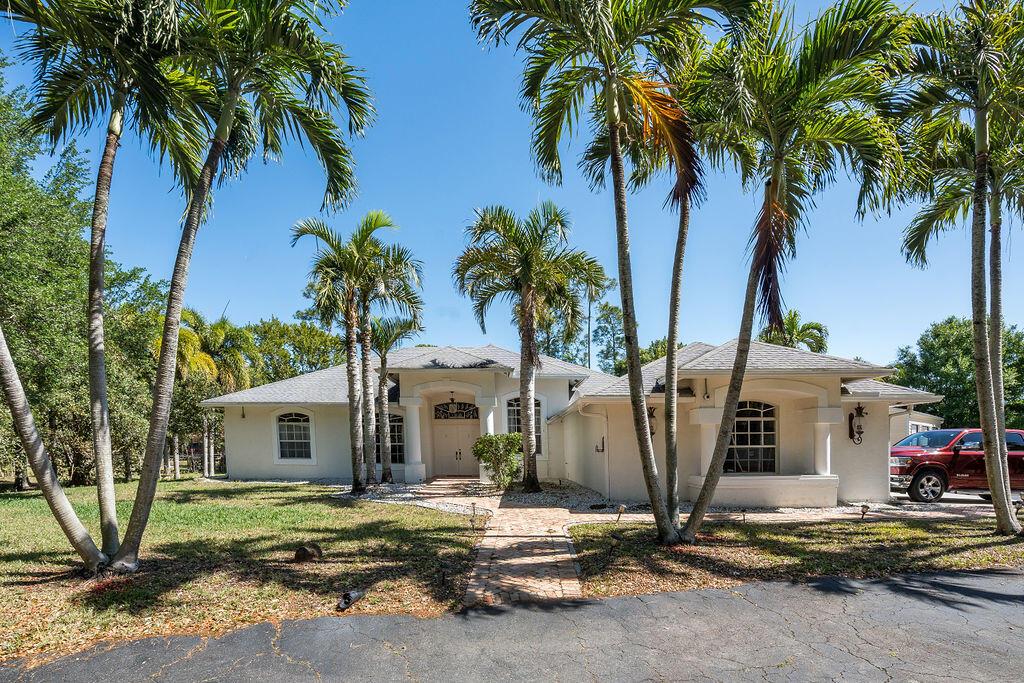 Nestled on 1.42 fully fenced acres, this stunning 2,460 sq. ft. custom home offers the perfect blend of space, privacy, and modern upgrades. With no HOA, you have the freedom to bring your RVs, boats, and animals, making this an ideal retreat for those who love the outdoors. Step inside to a bright and airy layout, where the fully renovated kitchen is a chef's dream, featuring custom cabinetry, granite countertops, and plenty of space to entertain. The home is equipped with a brand-new 2024 A/C system and a 2023 water heater, ensuring efficiency and comfort for years to come. The spacious master suite is a true sanctuary, with elegant French doors opening to a large covered patio. Just beyond, a heated 15 x 30 chlorine pool awaits, perfect for cooling off on hot summer days or enjoying a relaxing heated swim on cooler nights. A private mother-in-law suite with a cabana bath adds flexibility, while two additional bedrooms provide privacy for everyone.

For car enthusiasts, hobbyists, or those in need of extra storage, this property is unmatched. The three-car garage offers ample space, while just steps away, a 1,050 sq. ft. (30 x 35) workshop/garage with three bay doors, its own A/C system, and a complete electrical package provides endless possibilities.

Enjoy peace of mind with a fully fenced yard, perfect for pets to roam freely. This exceptional property is move-in ready and offers a rare opportunity to own a home that truly has it all!