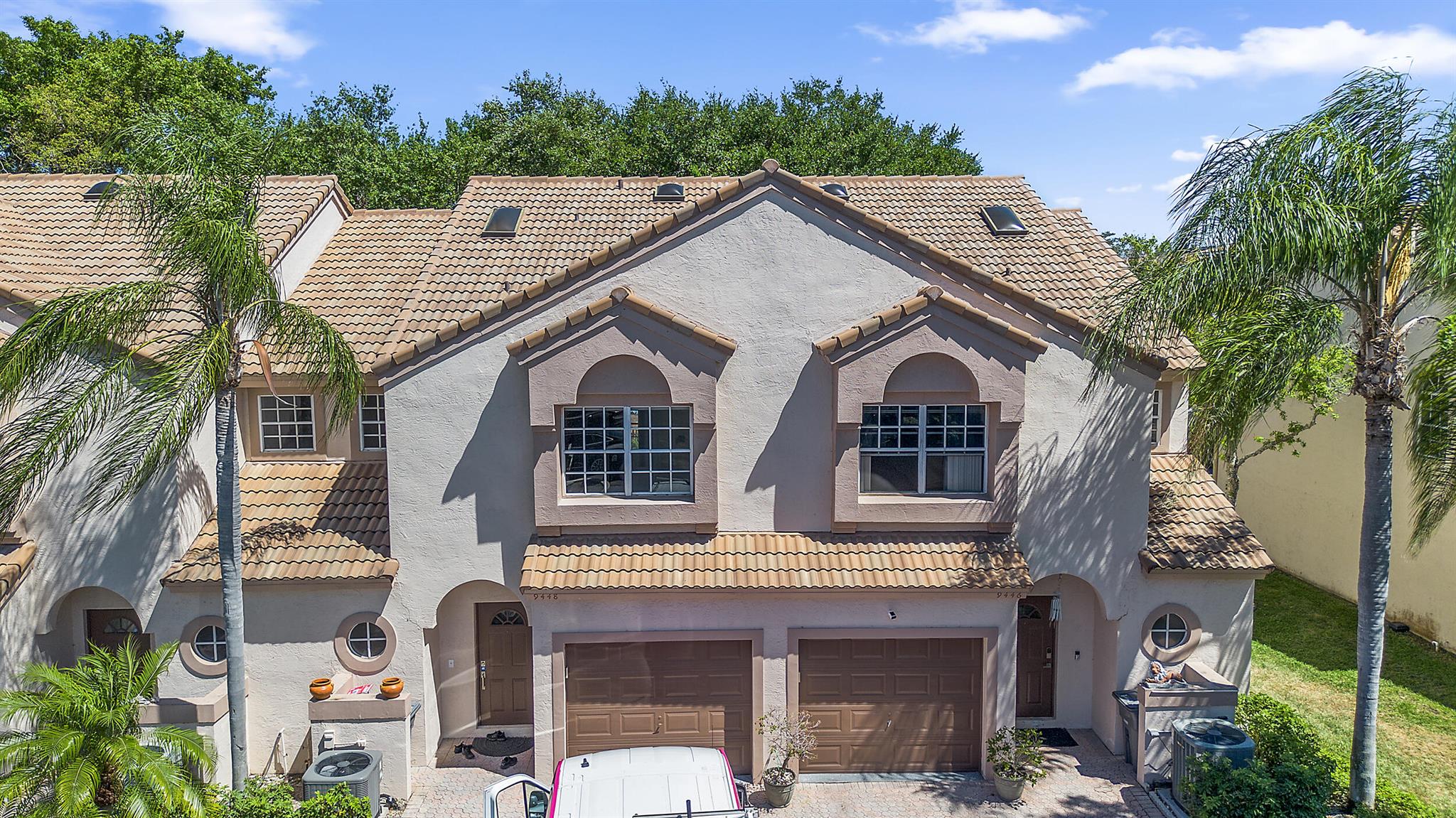 Discover this beautifully updated 3-bedroom, 2.5-bath townhome in the highly sought-after gated community of Coral Lake. This rare find offers an open-concept layout with soaring vaulted ceilings and skylights, filling the space with abundant natural light. Recently renovated, the home features brand-new flooring throughout, fresh paint, new baseboards, and smooth ceilings--no popcorn here! The thoughtfully designed open kitchen boasts solid wood 42'' cabinets, granite countertops, a full granite backsplash, a raised counter bar, and custom cabinetry, seamlessly blending style and functionality. Stainless steel appliances complement the space, while the adjacent separate laundry room adds extra convenience.Upstairs, the double-door entry leads to a spacious primary suite with an elegantly designed ensuite bath, while the oversized second and third bedrooms provide ample closet space. A newer roof (2018) with a transferable 5-year warranty and a recently installed AC (2022) offer peace of mind. The attached one-car garage provides additional storage, ensuring every inch of this home is optimized for comfort.

Nestled in a prime location, this home is just minutes from Uptown Boca's vibrant shopping, dining, and entertainment options, as well as top-rated schools, including Eagle's Landing Middle School. The community itself offers a maintenance-free lifestyle, with the HOA covering lawn care, pest control, and common area upkeep. Enjoy exclusive amenities such as two gated entrances, part-time roving security, and a resort-style pool with a cabana house.

This move-in-ready gem offers both luxury and convenience in a peaceful, private setting&#x14;don't miss the chance to make it yours!