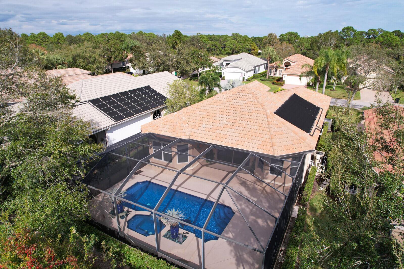 A TRUE GEM IN THE HEART OF PGA VILLAGE! Featuring a spectacular pool & spa complimented by an extended screened lanai-ideal for outdoor entertaining or peaceful relaxation. The pool is equipped with solar heating installed in 2018 & a new pool heater in 2023, providing year-round enjoyment in your own private oasis. This home boasts a light, bright open floor plan, freshly painted walls & brand new carpet in the bedrooms, providing a modern, welcoming feel throughout.  Updates include a newer A/C & water heater, ensuring comfort & efficiency.  Nestled close to the Legacy Golf & Tennis Club & The PGA Golf Club & it's 3 championship courses, a golfer's paradise.  Don't miss out on this opportunity to own a move-in-ready home in one of the most desirable communities in the area, PGA Village!