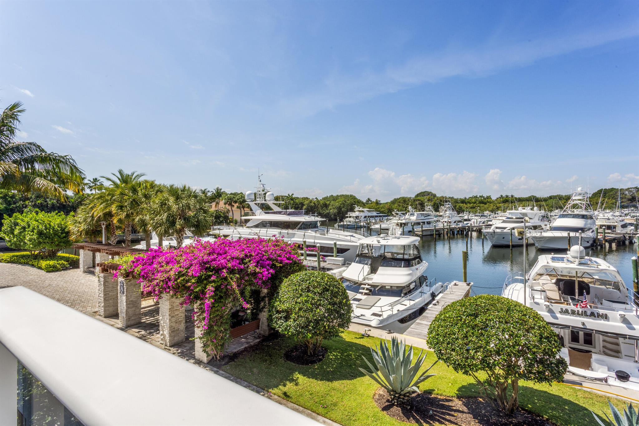 Experience the pinnacle of waterfront living just moments from the Intracoastal & pristine blue-water beaches. This rarely available extended-balcony residence offers breathtaking sunrise/sunset views over the marina. Nestled in one of Northern Palm Beach County's best-kept secrets, this boutique building provides the perfect blend of luxury, security, & convenience--just minutes from Palm Beach & Jupiter Island. Step from your privately keyed elevator into a spacious, open-concept floor plan designed for seamless indoor-outdoor living, with an expansive balcony that captures the beauty of the marina at every turn. 2 bedroom plus bunk room for kids/office. Amenities include a 24/7 manned gate, fitness center, heated pool,sauna, business center, club room, golf simulator, wine room, storage