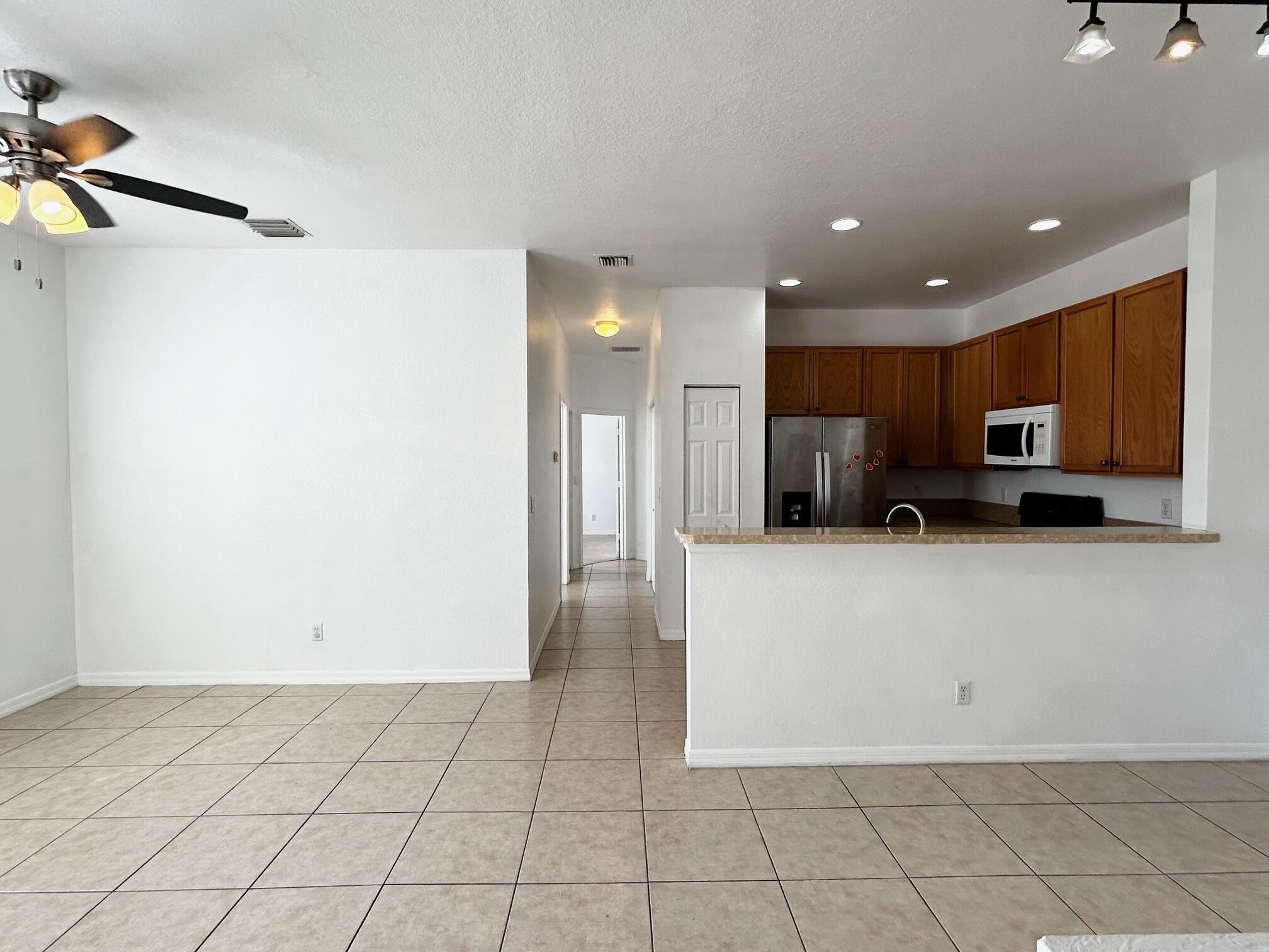 This beautifully maintained 2-bedroom, 2-bath condo is located in a quiet, gated community and offers both comfort and convenience. featuring a private attached garage with its own driveway, the unit has been recently updated with brand new laminate flooring and fresh paint throughout. The community includes a variety of amenities such as a sparkling pool, multiple playgrounds, BBQ areas and picnic tables under lush landscaping. Water is included in the rent, making this home an excellent value in a peaceful, family-friendly seating.